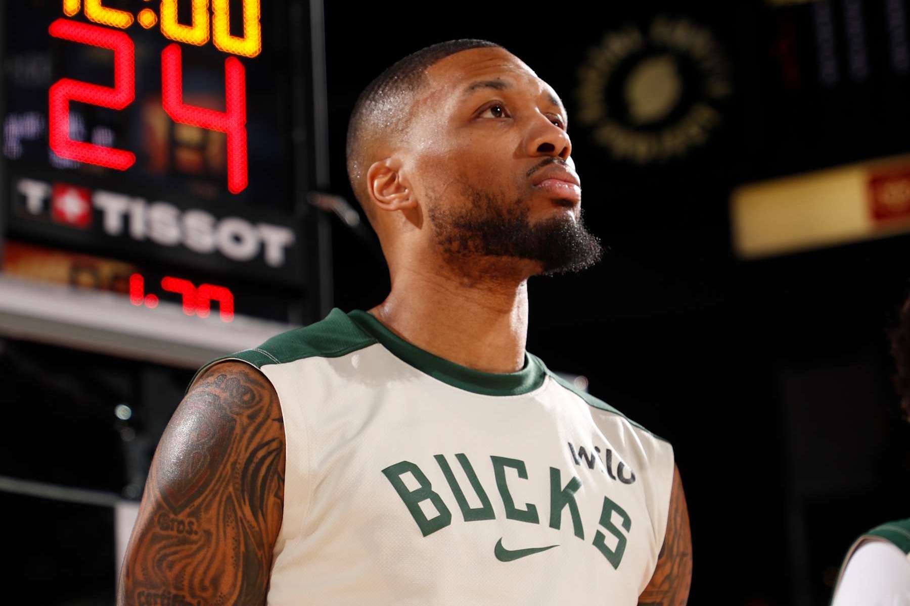 PORTLAND, OR - JANUARY 28: Damian Lillard #0 of the Milwaukee Bucks stands for the National Anthem before the game against the Portland Trail Blazers on January 28, 2025 at the Moda Center Arena in Portland, Oregon. NOTE TO USER: User expressly acknowledges and agrees that, by downloading and or using this photograph, user is consenting to the terms and conditions of the Getty Images License Agreement. Mandatory Copyright Notice: Copyright 2025 NBAE (Photo by Cameron Browne/NBAE via Getty Images)