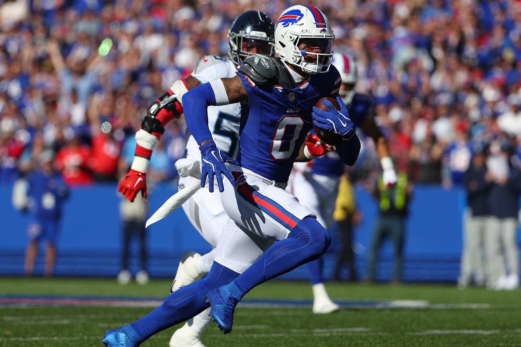 ORCHARD PARK, NEW YORK - OCTOBER 20: Keon Coleman #0 of the Buffalo Bills runs the ball after a catch against the Tennessee Titans during the second quarter at Highmark Stadium on October 20, 2024 in Orchard Park, New York. (Photo by Timothy T Ludwig/Getty Images)