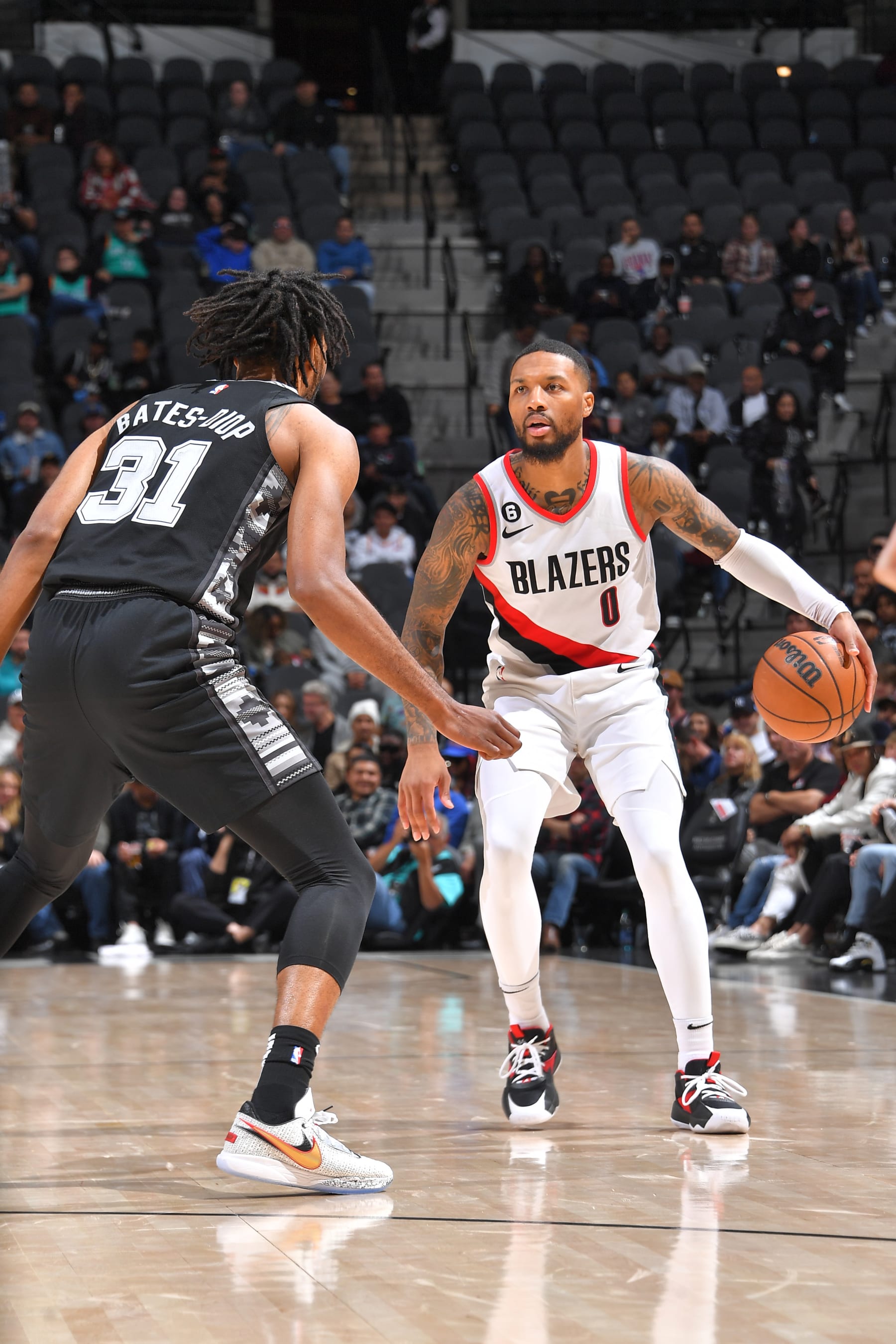 SAN ANTONIO, TX - DECEMBER 14: Damian Lillard #0 of the Portland Trail Blazers handles the ball during the game against the San Antonio Spurs on December 14, 2022 at the AT&T Center in San Antonio, Texas. NOTE TO USER: User expressly acknowledges and agrees that, by downloading and or using this photograph, user is consenting to the terms and conditions of the Getty Images License Agreement. Mandatory Copyright Notice: Copyright 2022 NBAE (Photos by Michael Gonzales/NBAE via Getty Images)