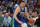 DALLAS, TX - DECEMBER 27: Luka Doncic #77 of the Dallas Mavericks drives to the basket during the game against New York Knicks on December 27, 2022 at the American Airlines Center in Dallas, Texas. NOTE TO USER: User expressly acknowledges and agrees that, by downloading and or using this photograph, User is consenting to the terms and conditions of the Getty Images License Agreement. Mandatory Copyright Notice: Copyright 2022 NBAE (Photo by Glenn James/NBAE via Getty Images)