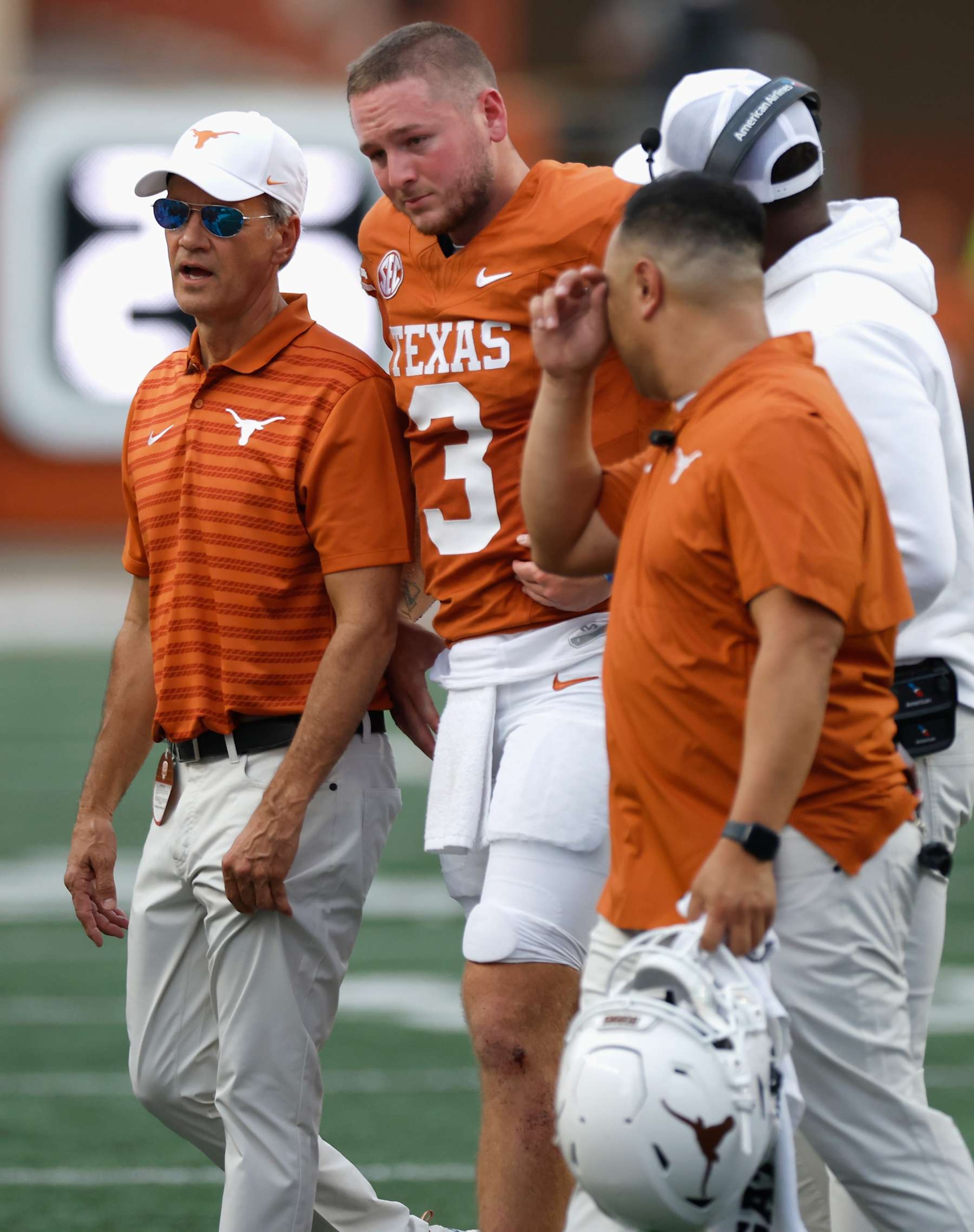 AUSTIN, TEXAS - SEPTEMBER 14: Quinn Ewers #3 of the Texas Longhorns is tended to by medical staff after an injury in the second quarter against the UTSA Roadrunners at Darrell K Royal-Texas Memorial Stadium on September 14, 2024 in Austin, Texas. (Photo by Tim Warner/Getty Images)