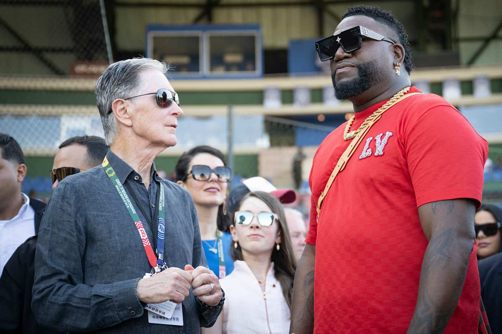 SANTO DOMNDO, DOMINICAN REPUBLIC - MARCH 9:  Boston Red Sox Principal Owner John Henry talks with Former Boston Red Sox designated hitter David Ortiz before the 2024 Dominican Republic Series game against the Tampa Bay Rays as part of the MLB World Tour at Estadio Quisqueya on March 9, 2024 in Santo Domingo, Dominican Republic. (Photo by Maddie Malhotra/Boston Red Sox/Getty Images)