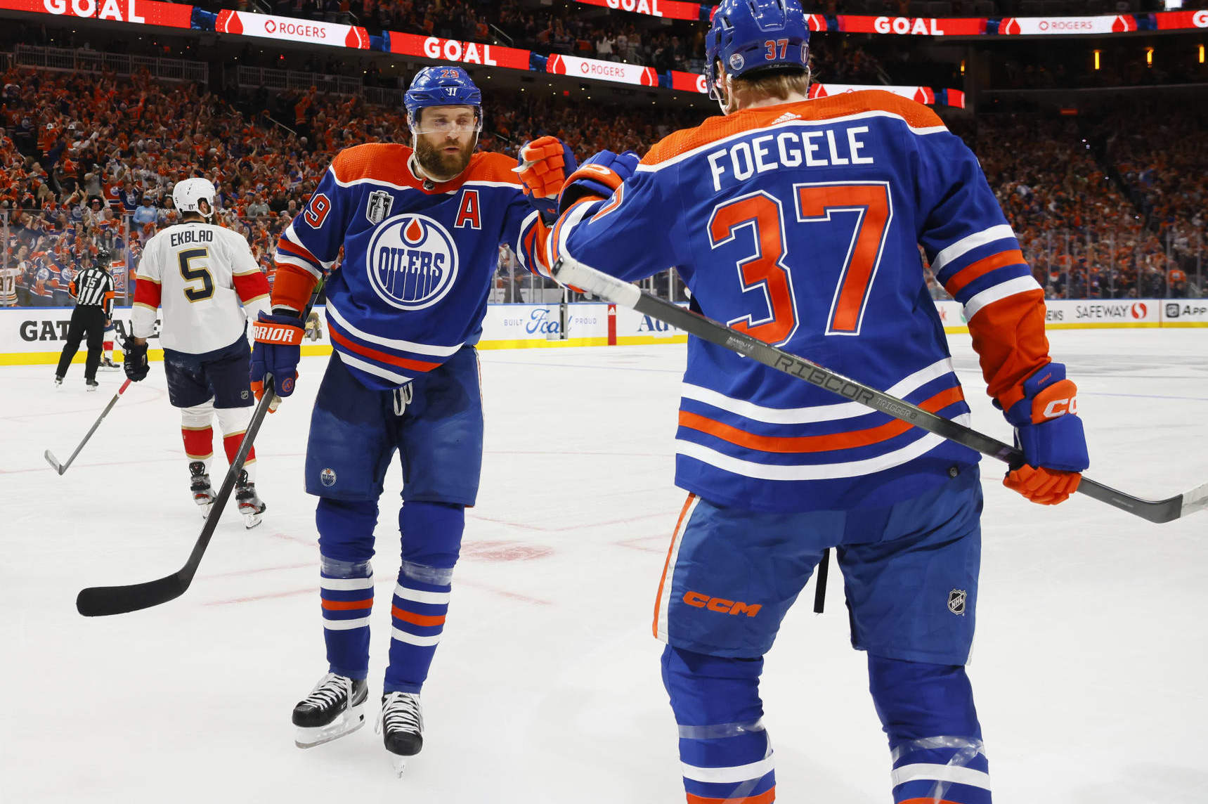 EDMONTON, ALBERTA - JUNE 21: Leon Draisaitl #29 and Warren Foegele #37 of the Edmonton Oilers celebrate after Foegele's goal during the first period of Game Six of the 2024 Stanley Cup Final against the Florida Panthers at Rogers Place on June 21, 2024 in Edmonton, Alberta. (Photo by Bruce Bennett/Getty Images)