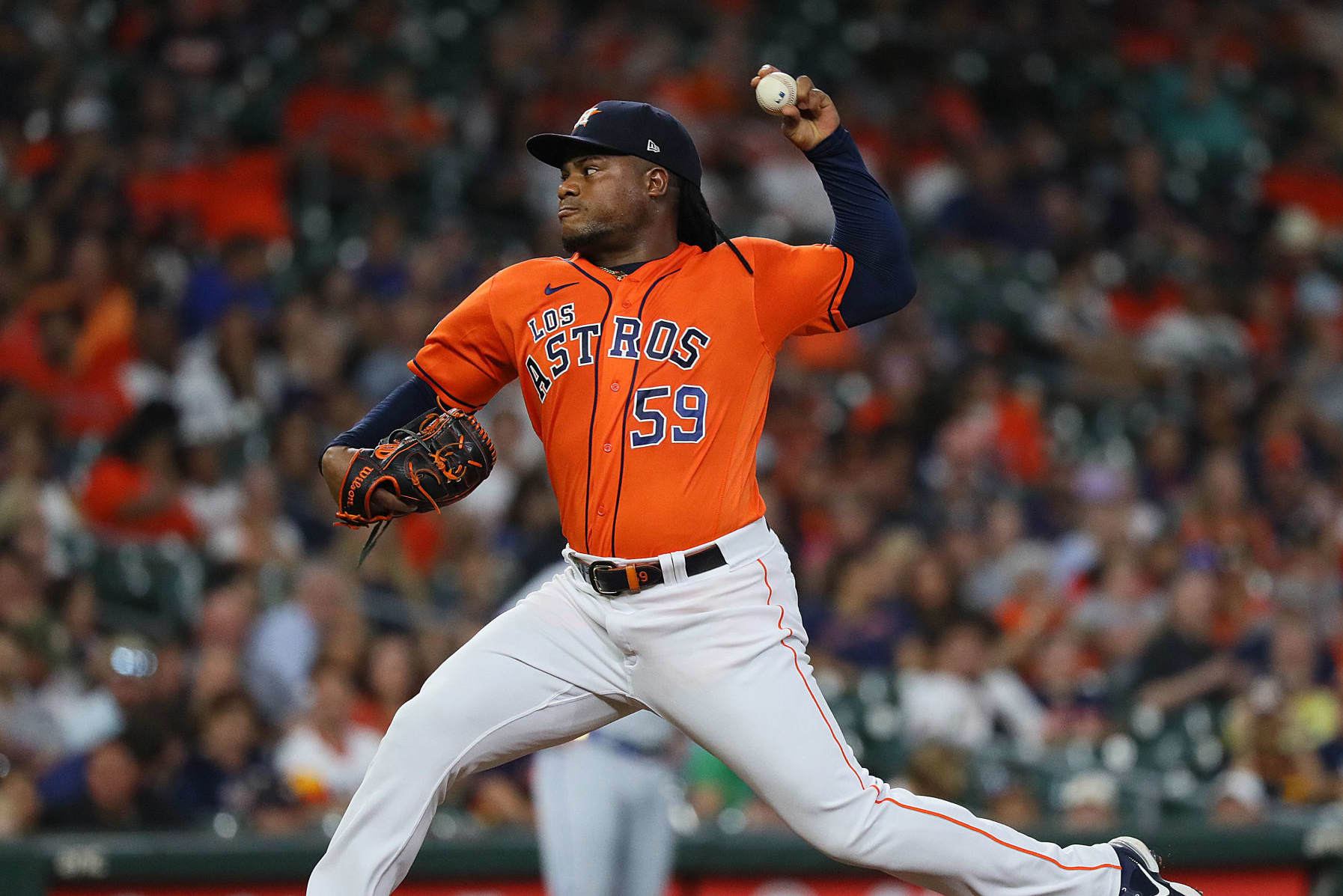 HOUSTON, TX - JUNE 17: Cincinnati Reds starting pitcher Hunter Greene (21)  delivers a pitch during the baseball game between the Cincinnati Reds and  Houston Astros at Minute Maid Park on June