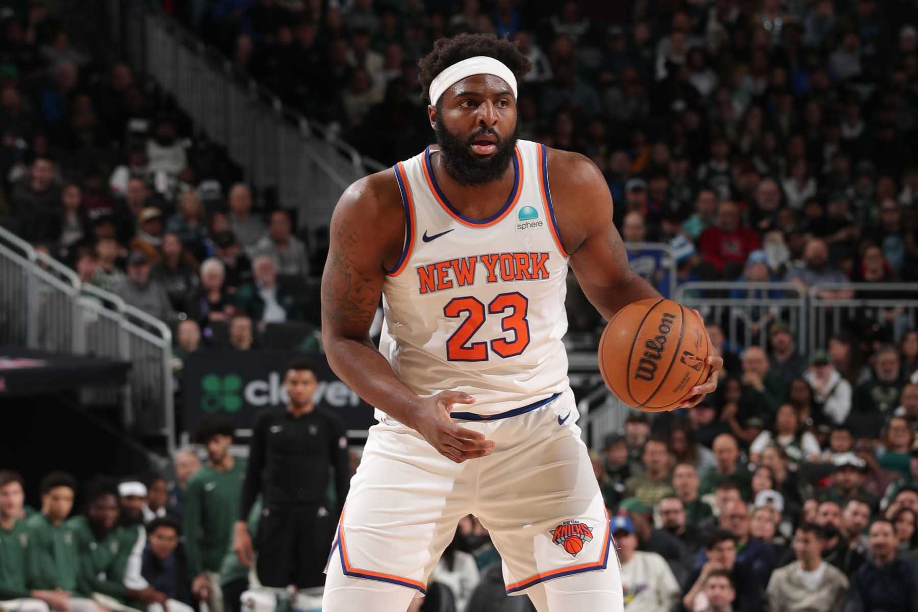 MILWAUKEE, WI - APRIL 7: Mitchell Robinson #23 of the New York Knicks handles the ball during the game against the Milwaukee Bucks on April 7, 2024 at the Fiserv Forum Center in Milwaukee, Wisconsin. NOTE TO USER: User expressly acknowledges and agrees that, by downloading and or using this Photograph, user is consenting to the terms and conditions of the Getty Images License Agreement. Mandatory Copyright Notice: Copyright 2024 NBAE (Photo by Gary Dineen/NBAE via Getty Images).