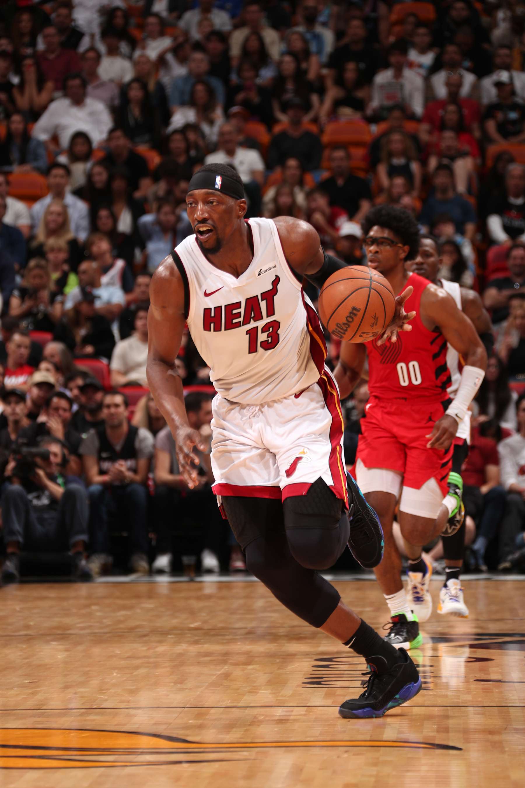MIAMI, FL - MARCH 29: Bam Adebayo #13 of the Miami Heat dribbles the ball during the game against the Portland Trail Blazers on March 29, 2024 at Kaseya Center in Miami, Florida. NOTE TO USER: User expressly acknowledges and agrees that, by downloading and or using this Photograph, user is consenting to the terms and conditions of the Getty Images License Agreement. Mandatory Copyright Notice: Copyright 2024 NBAE (Photo by Issac Baldizon/NBAE via Getty Images)
