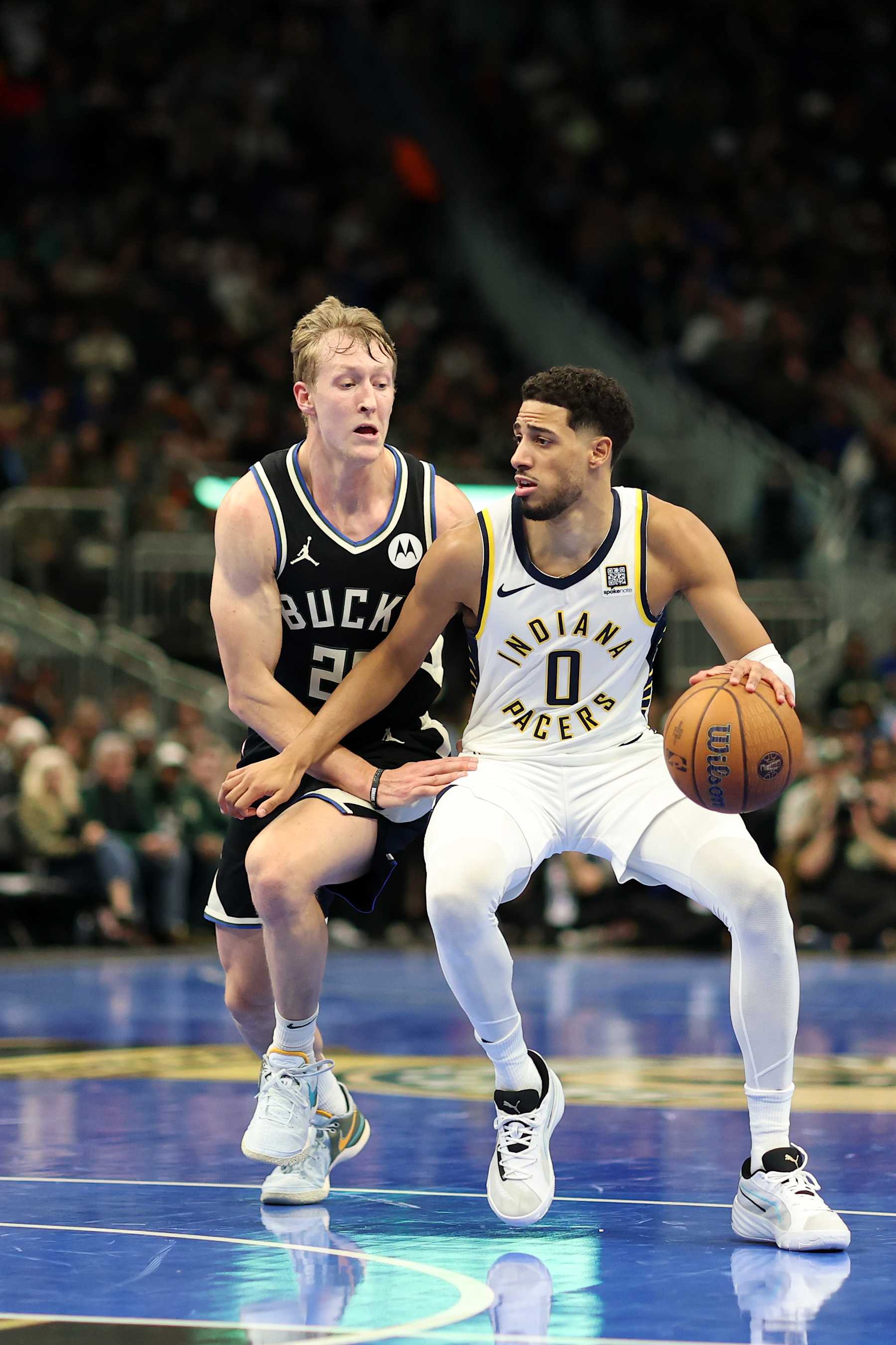 MILWAUKEE, WISCONSIN - NOVEMBER 22: Tyrese Haliburton #0 of the Indiana Pacers drives around AJ Green #20 of the Milwaukee Bucks during a game in the NBA Emirates Cup at Fiserv Forum on November 22, 2024 in Milwaukee, Wisconsin. NOTE TO USER: User expressly acknowledges and agrees that, by downloading and or using this photograph, User is consenting to the terms and conditions of the Getty Images License Agreement. (Photo by Stacy Revere/Getty Images)