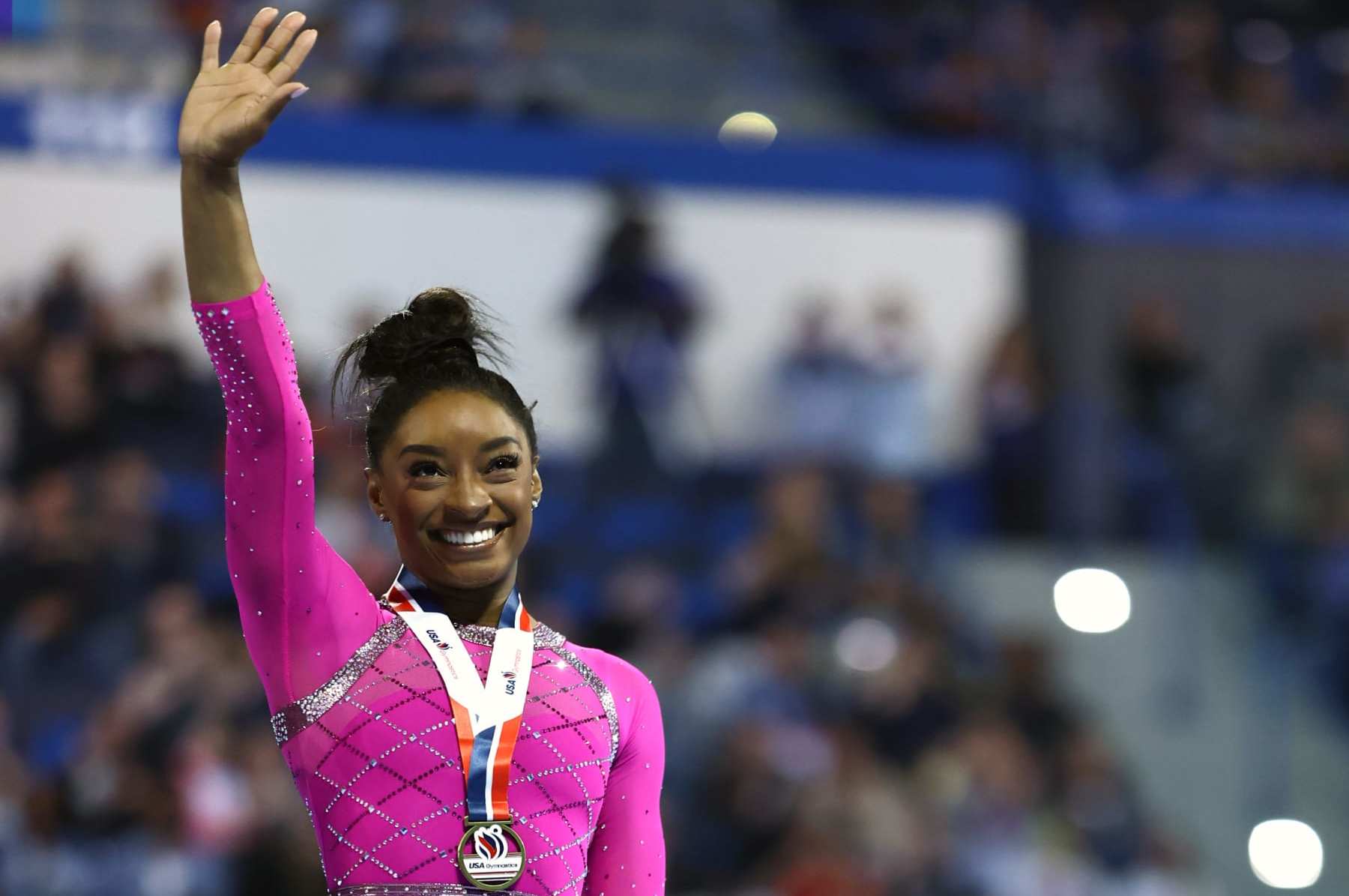 HARTFORD, CONNECTICUT - MAY 18: Simone Biles celebrates after taking first place in the floor routine during the 2024 Core Hydration Classic at XL Center on May 18, 2024 in Hartford, Connecticut. (Photo by Tim Nwachukwu/Getty Images)
