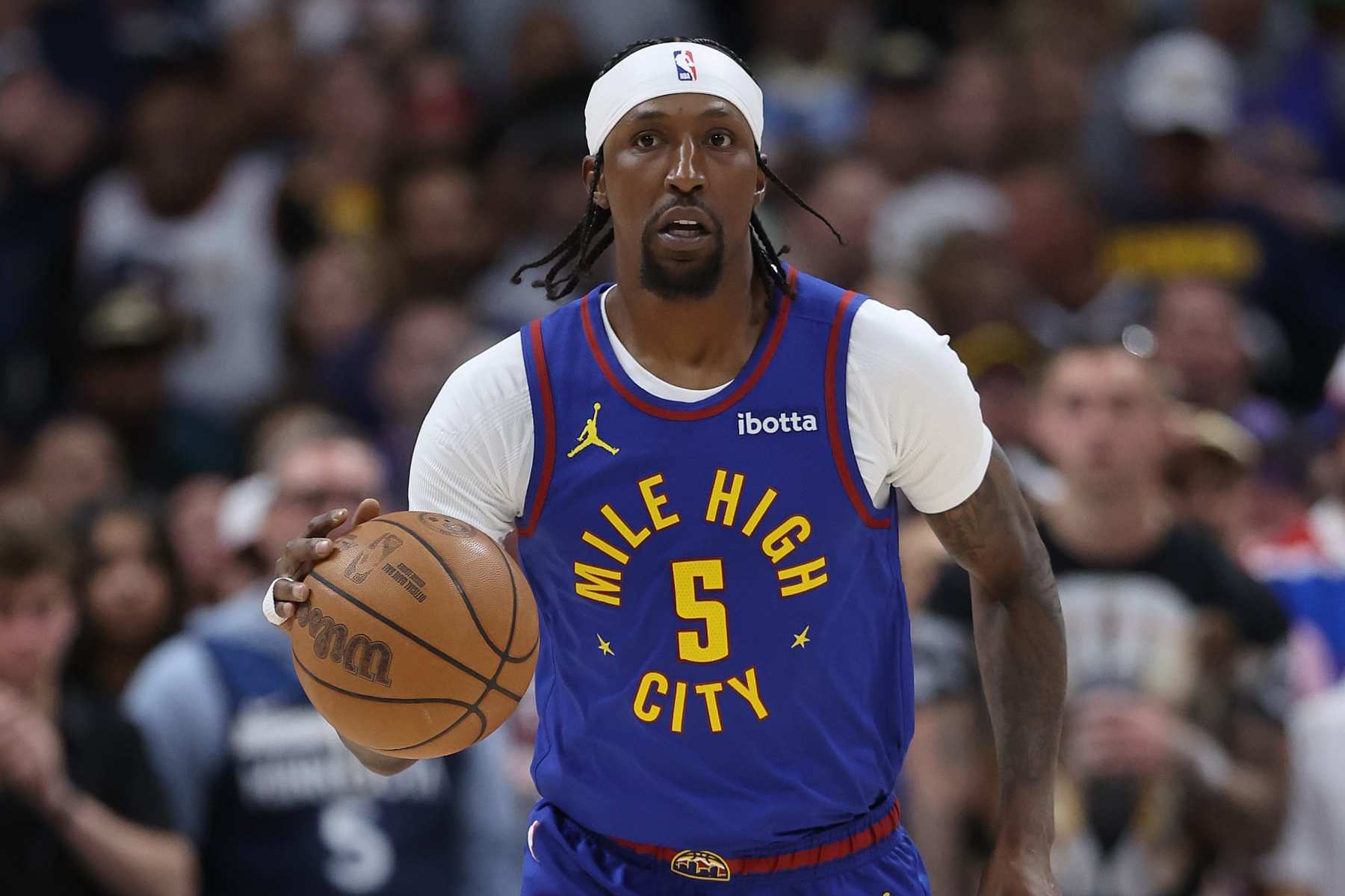 DENVER, COLORADO - MAY 04: Kentavious Caldwell-Pope #5 of the Denver Nuggets brings the ball down the court against the Minnesota Timberwolves in the first quarter during Game One of the Western Conference Second Round Playoffs at Ball Arena on May 04, 2024 in Denver, Colorado. NOTE TO USER: User expressly acknowledges and agrees that, by downloading and or using this photograph, User is consenting to the terms and conditions of the Getty Images License Agreement. (Photo by Matthew Stockman/Getty Images)