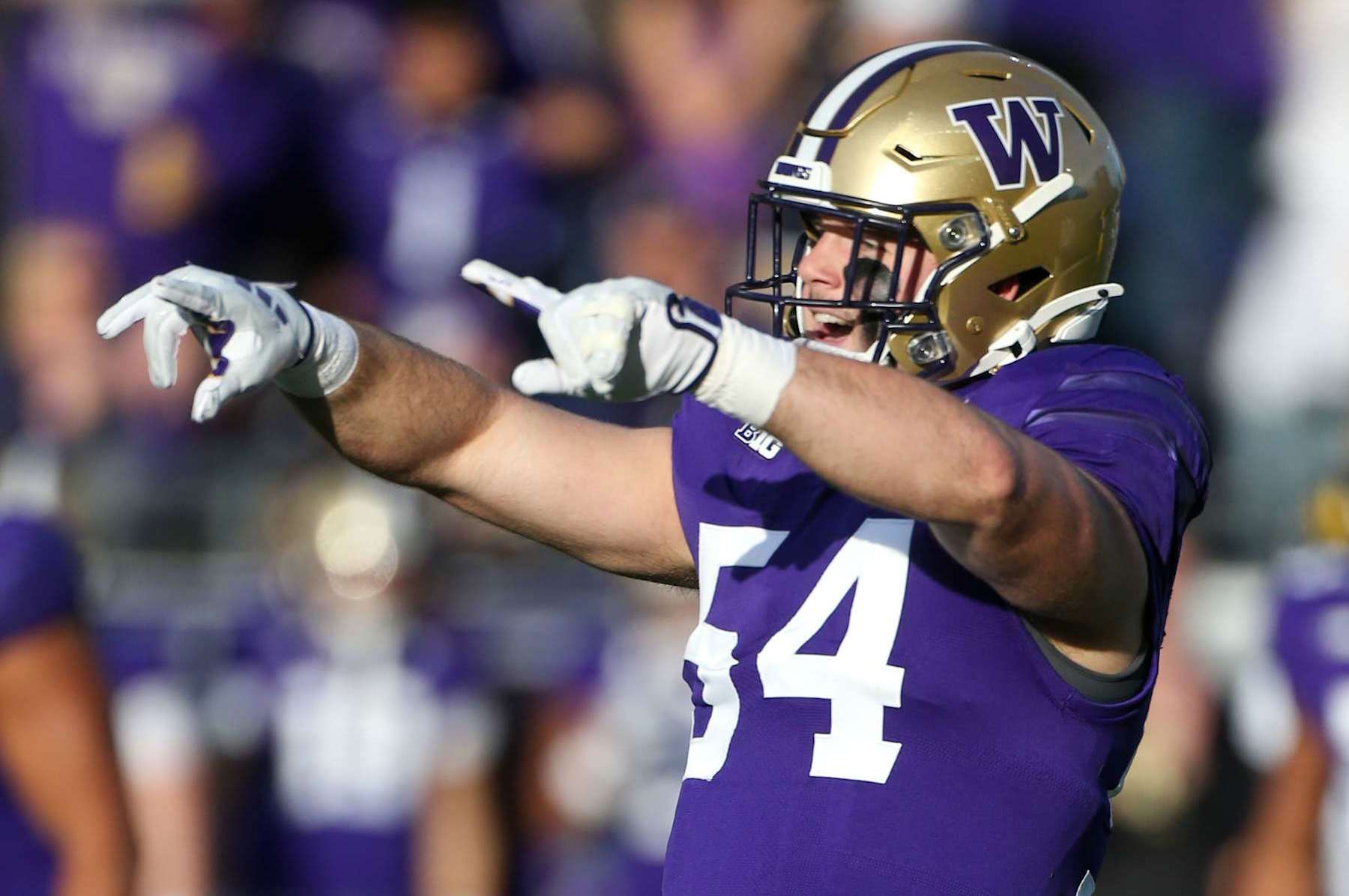 SEATTLE, WA - OCTOBER 05:  Washington #54 (LB) Drew Fowler celebrates during a college football game between the Michigan Wolverines and the Washington Huskies on October 05, 2024, at Alaska Airlines Field at Husky Stadium in Seattle, WA. (Photo by Jesse Beals/Icon Sportswire via Getty Images)