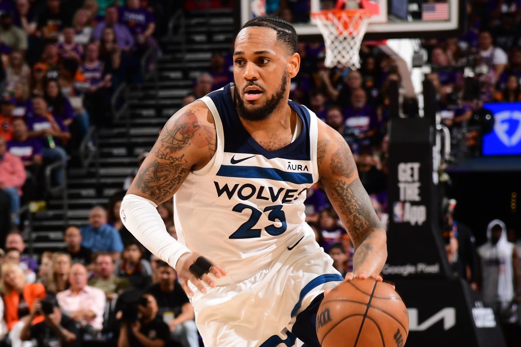 PHOENIX, AZ - APRIL 26: Monte Morris #23 of the Minnesota Timberwolves handles the ball during the game against the Phoenix Suns on April 26, 2024 at Footprint Center in Phoenix, Arizona. NOTE TO USER: User expressly acknowledges and agrees that, by downloading and or using this photograph, user is consenting to the terms and conditions of the Getty Images License Agreement. Mandatory Copyright Notice: Copyright 2024 NBAE (Photo by Kate Frese/NBAE via Getty Images)
