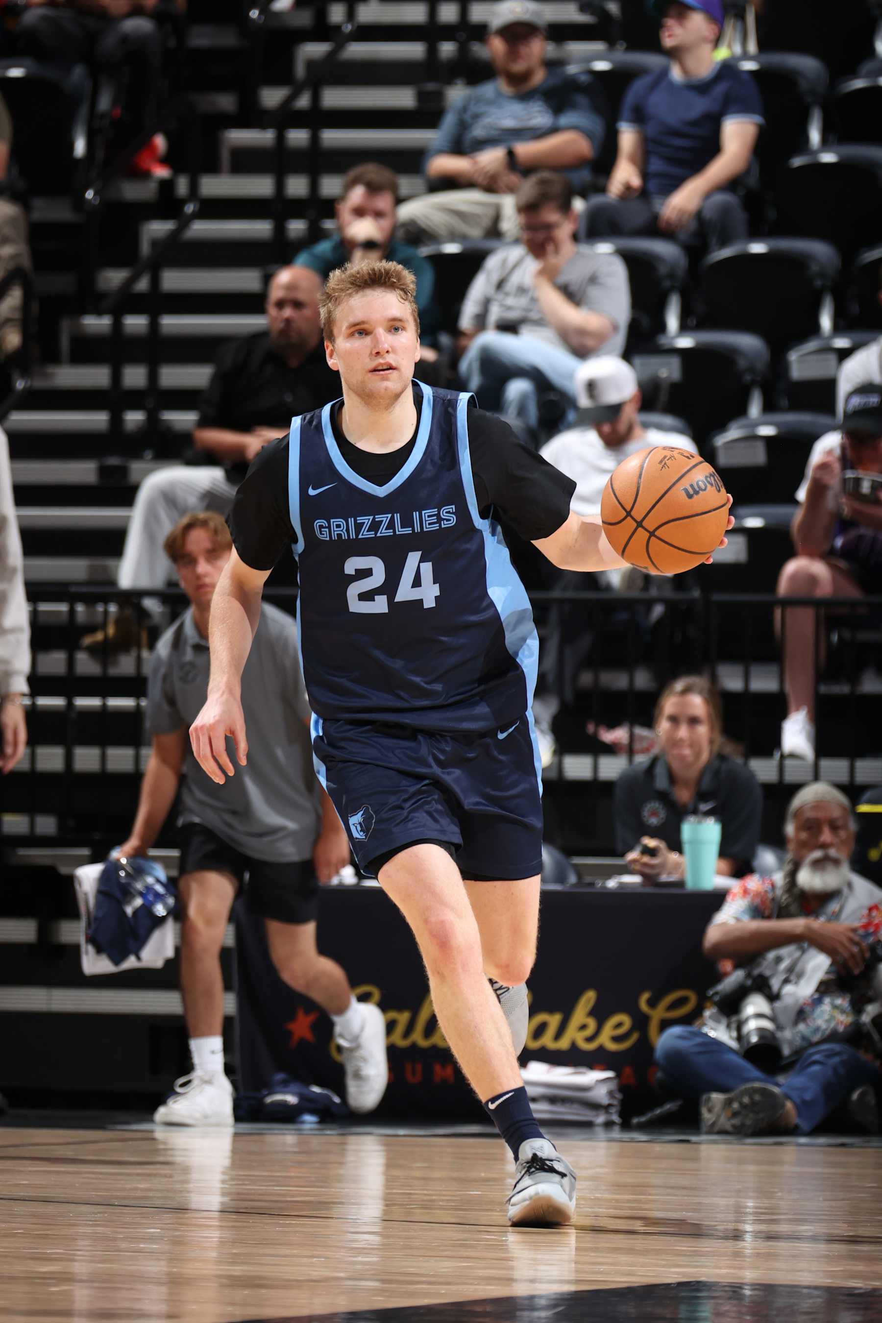 SALT LAKE CITY, UT - JULY 9: Cam Spencer #24 of the Memphis Grizzlies  handles the ball during the game against the Philadelphia 76ers during the 2024 NBA Salt Lake City Summer League on July 9, 2024 at Delta Center in Salt Lake City, Utah. NOTE TO USER: User expressly acknowledges and agrees that, by downloading and or using this Photograph, User is consenting to the terms and conditions of the Getty Images License Agreement. Mandatory Copyright Notice: Copyright 2024 NBAE (Photo by Melissa Majchrzak/NBAE via Getty Images)