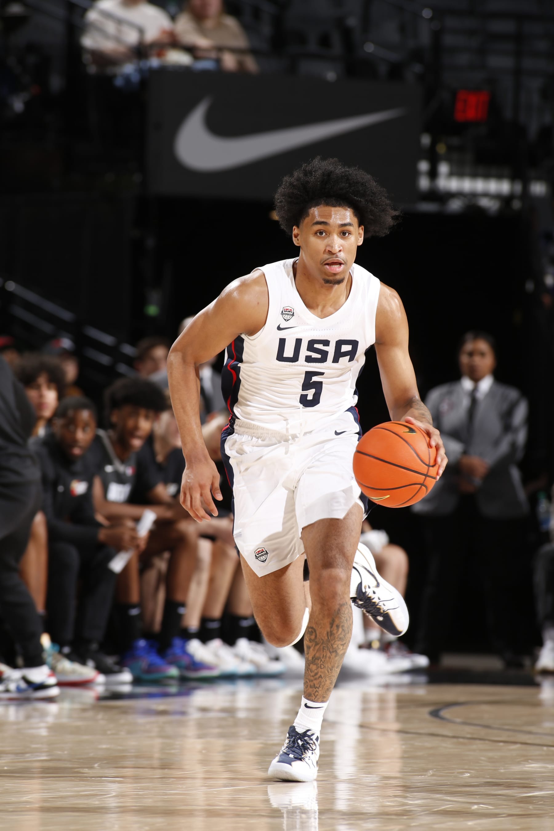 PORTLAND, OR - APRIL 13: Dylan Harper #5 of Team USA dribbles the ball during the game against Team World during the 2024 Nike Hoop Summit on April 13, 2024 at the Moda Center Arena in Portland, Oregon. NOTE TO USER: User expressly acknowledges and agrees that, by downloading and or using this photograph, user is consenting to the terms and conditions of the Getty Images License Agreement. Mandatory Copyright Notice: Copyright 2024 NBAE (Photo by Cameron Browne/NBAE via Getty Images)