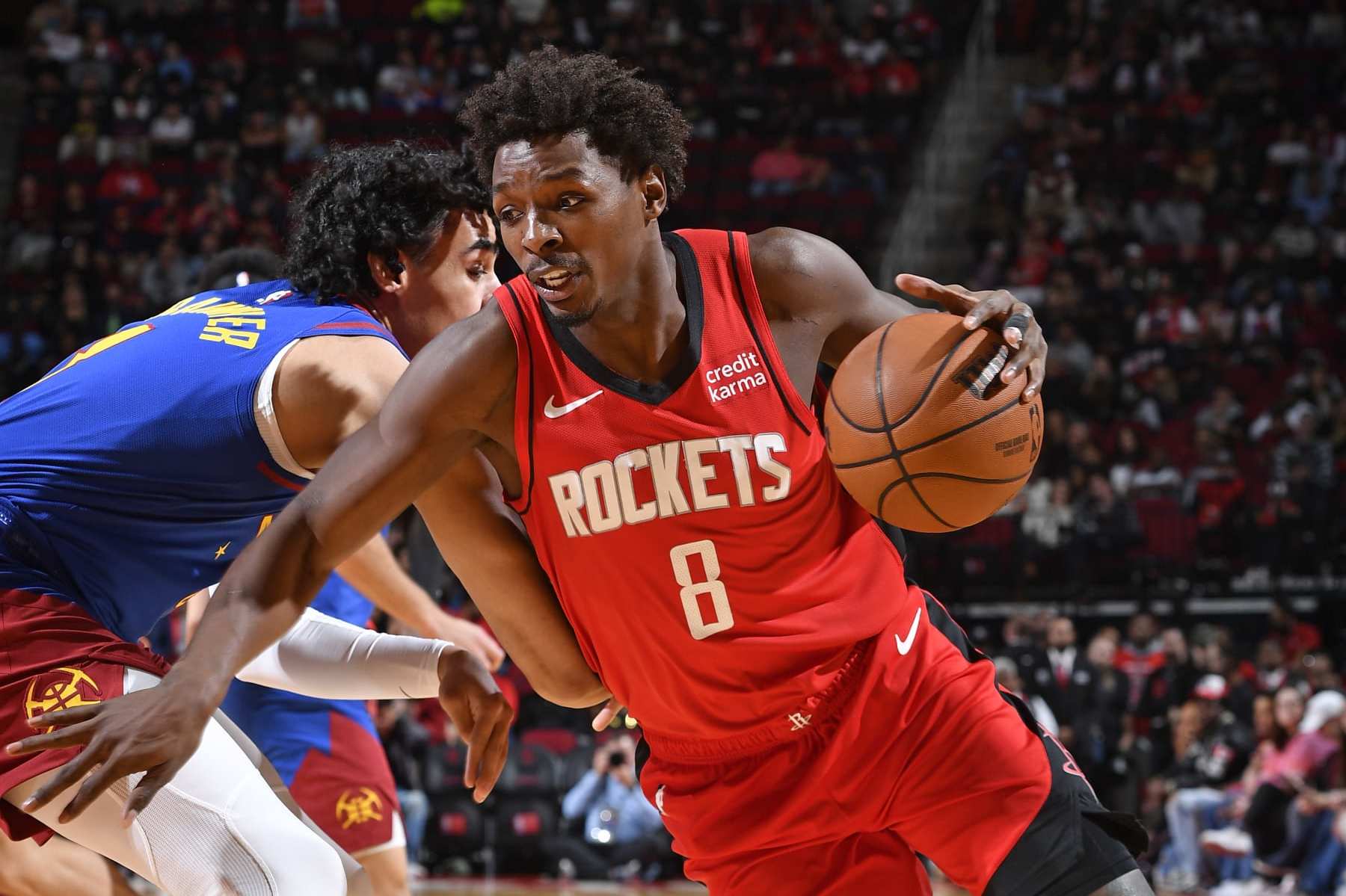 HOUSTON, TX - NOVEMBER 12: Jae'Sean Tate #8 of the Houston Rockets drives to the basket during the game against the Denver Nuggets on November 12, 2023 at the Toyota Center in Houston, Texas. NOTE TO USER: User expressly acknowledges and agrees that, by downloading and or using this photograph, User is consenting to the terms and conditions of the Getty Images License Agreement. Mandatory Copyright Notice: Copyright 2023 NBAE (Photo by Logan Riely/NBAE via Getty Images)