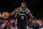 NEW YORK, NEW YORK - NOVEMBER 30:  Kyrie Irving #11 of the Brooklyn Nets drives against the Washington Wizards during their game at Barclays Center on November 30, 2022 in New York City.  User expressly acknowledges and agrees that, by downloading and or using this photograph, User is consenting to the terms and conditions of the Getty Images License Agreement.  (Photo by Al Bello/Getty Images)