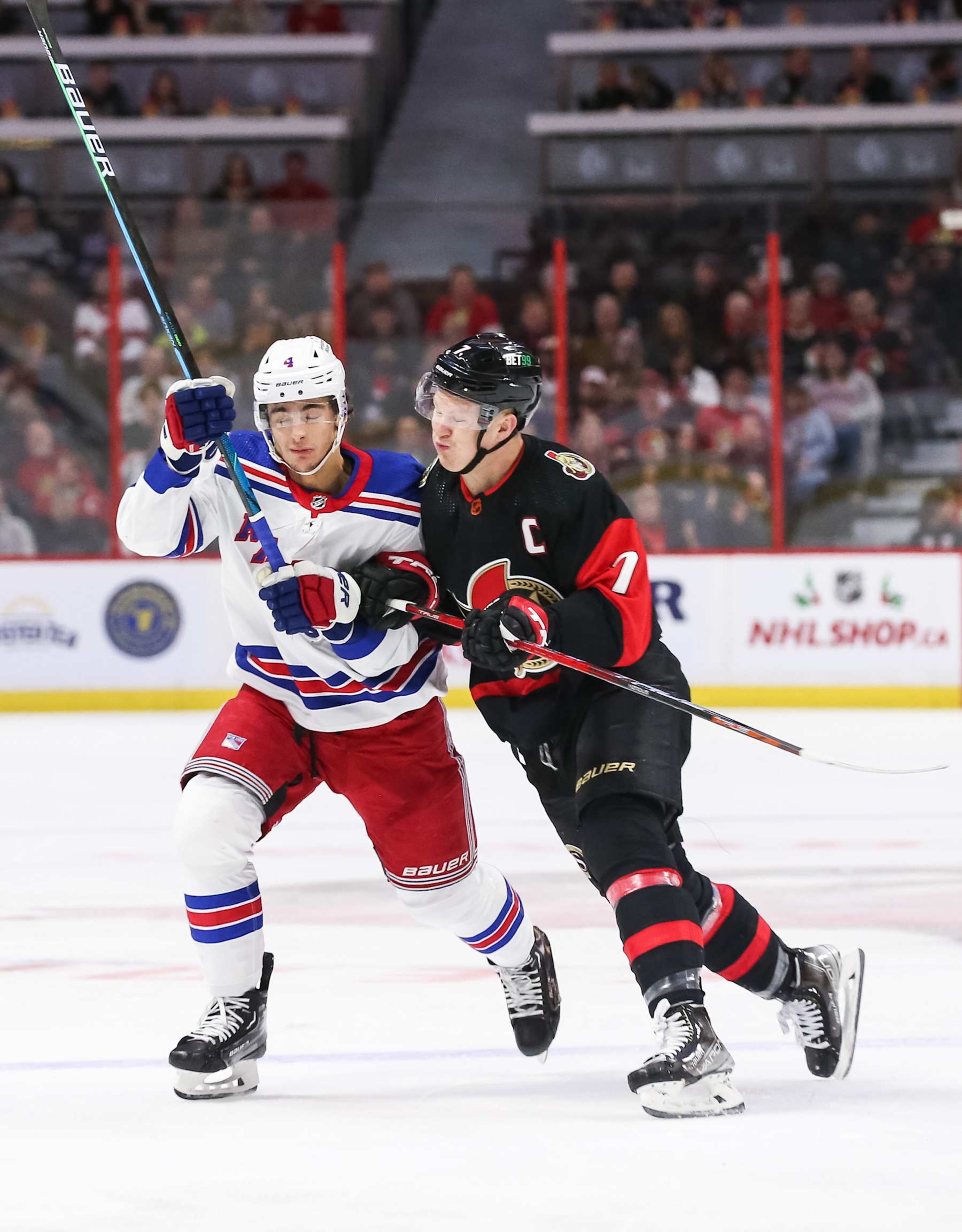 OTTAWA, ONTARIO - NOVEMBER 30: Brady Tkachuk #7 of the Ottawa Senators bodychecks Braden Schneider #4 of the New York Rangers during the first period at Canadian Tire Centre on November 30, 2022 in Ottawa, Ontario, Canada. (Photo by Chris Tanouye/Freestyle Photo/Getty Images) OTTAWA, ONTARIO - NOVEMBER 30: Brady Tkachuk #7 of the Ottawa Senators bodychecks Braden Schneider #4 of the New York Rangers during the first period at Canadian Tire Centre on November 30, 2022 in Ottawa, Ontario, Canada. (Photo by Chris Tanouye/Freestyle Photo/Getty Images)