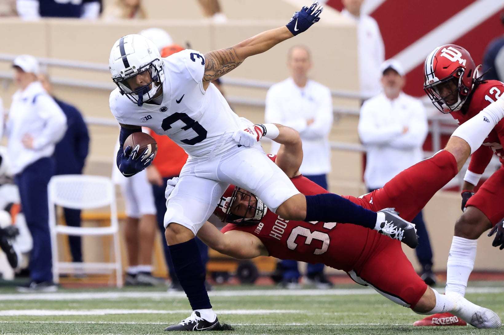 BLOOMINGTON, INDIANA - NOVEMBER 05: Parker Washington #3 of the Penn State Nittany Lions is tackled by Ryan Barnes #39 of the Indiana Hoosiers during the second half at Memorial Stadium on November 05, 2022 in Bloomington, Indiana. (Photo by Justin Casterline/Getty Images)