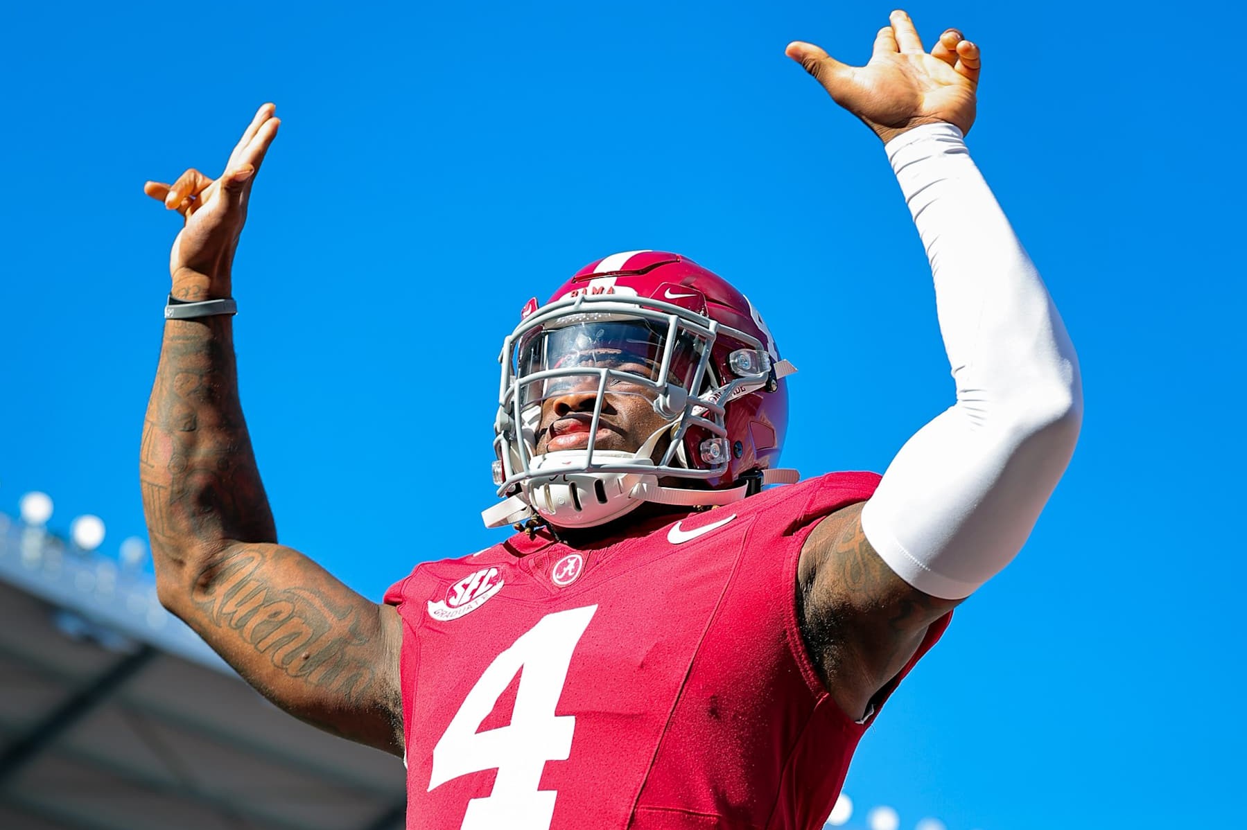 TUSCALOOSA, ALABAMA - NOVEMBER 16: Jalen Milroe #4 of the Alabama Crimson Tide puts up his guns prior to kickoff against the Mercer Bears at Bryant-Denny Stadium on November 16, 2024 in Tuscaloosa, Alabama. (Photo by Brandon Sumrall/Getty Images)