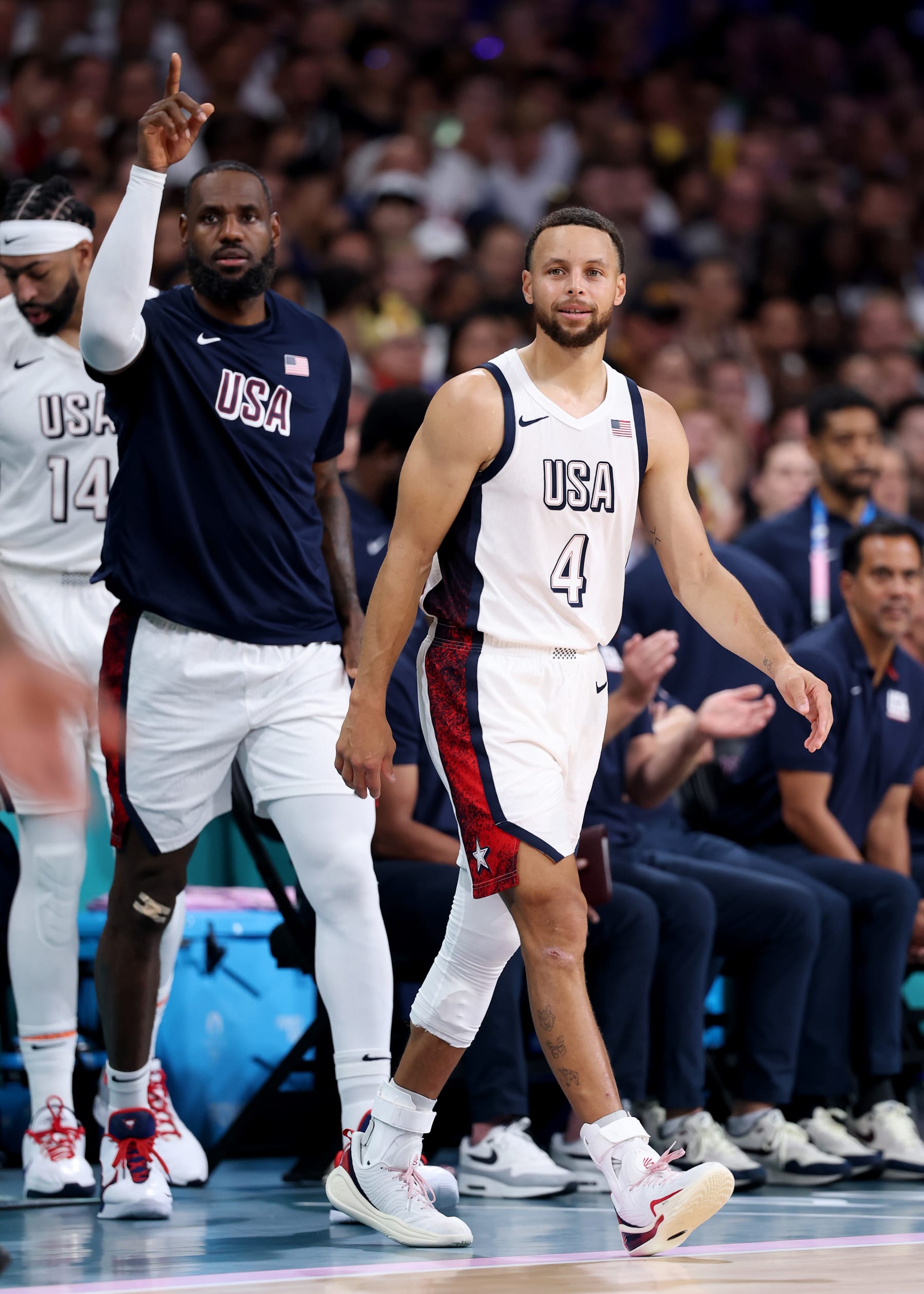 LILLE, FRANCE - JULY 31: Lebron James #6 and Stephen Curry #4 of Team United States look on during a Men's Group Phase - Group C game between the United States and South Sudan on day five of the Olympic Games Paris 2024 at Stade Pierre Mauroy on July 31, 2024 in Lille, France. (Photo by Gregory Shamus/Getty Images)
