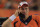 DENVER, CO - AUGUST 29:  Quarterback Peyton Manning #18 of the Denver Broncos talks on the phone on the sideline against the Arizona Cardinals during preseason action at Sports Authority Field at Mile High on August 29, 2013 in Denver, Colorado. The Cardinals defeated the Broncos 32-24.  (Photo by Doug Pensinger/Getty Images) 