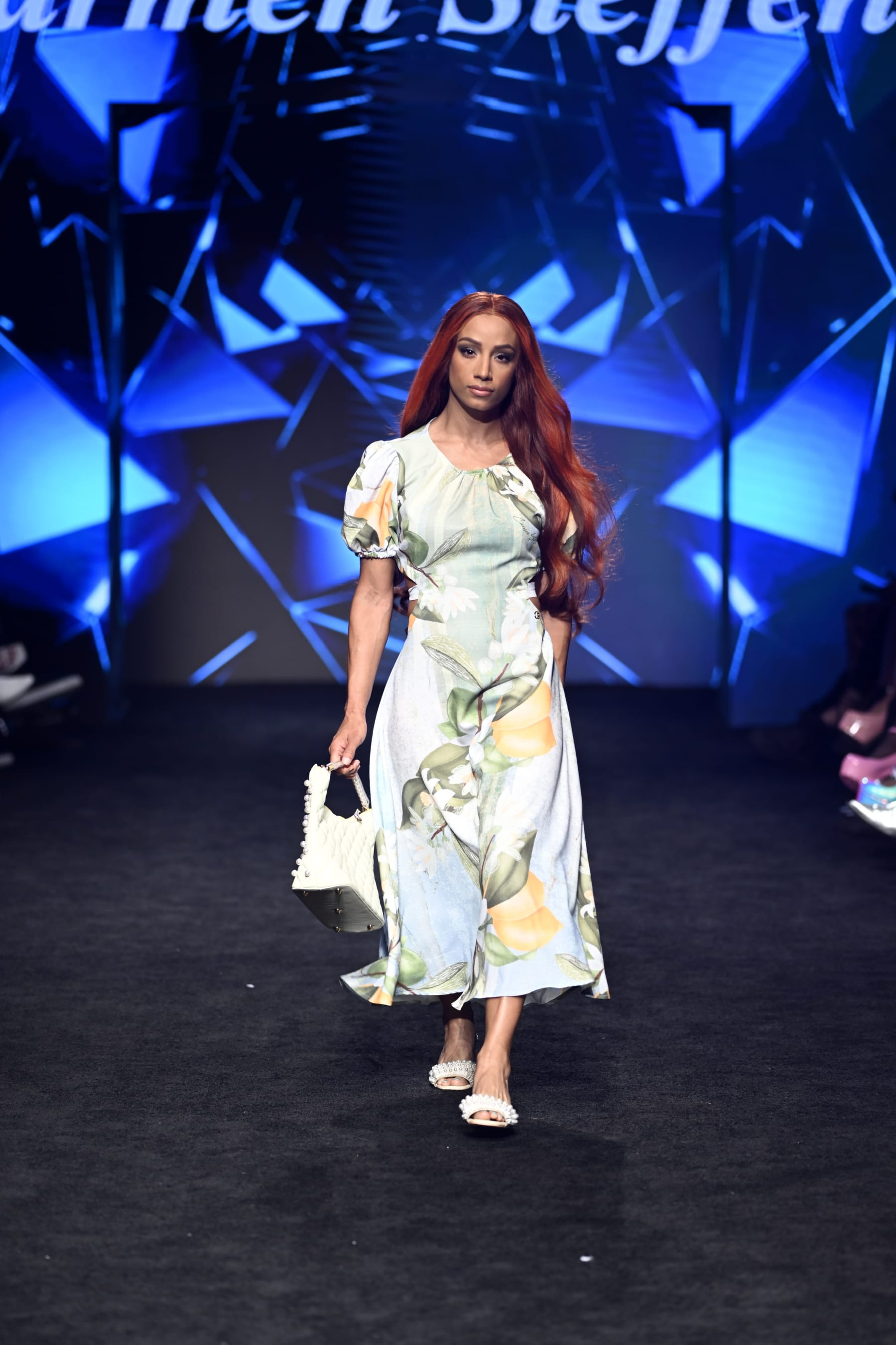 LOS ANGELES, CALIFORNIA - OCTOBER 13: Sasha Banks walks the runway wearing Carmen Steffens at The Majestic Downtown on October 13, 2022 in Los Angeles, California. (Photo by Arun Nevader/Getty Images for Art Hearts Fashion)
