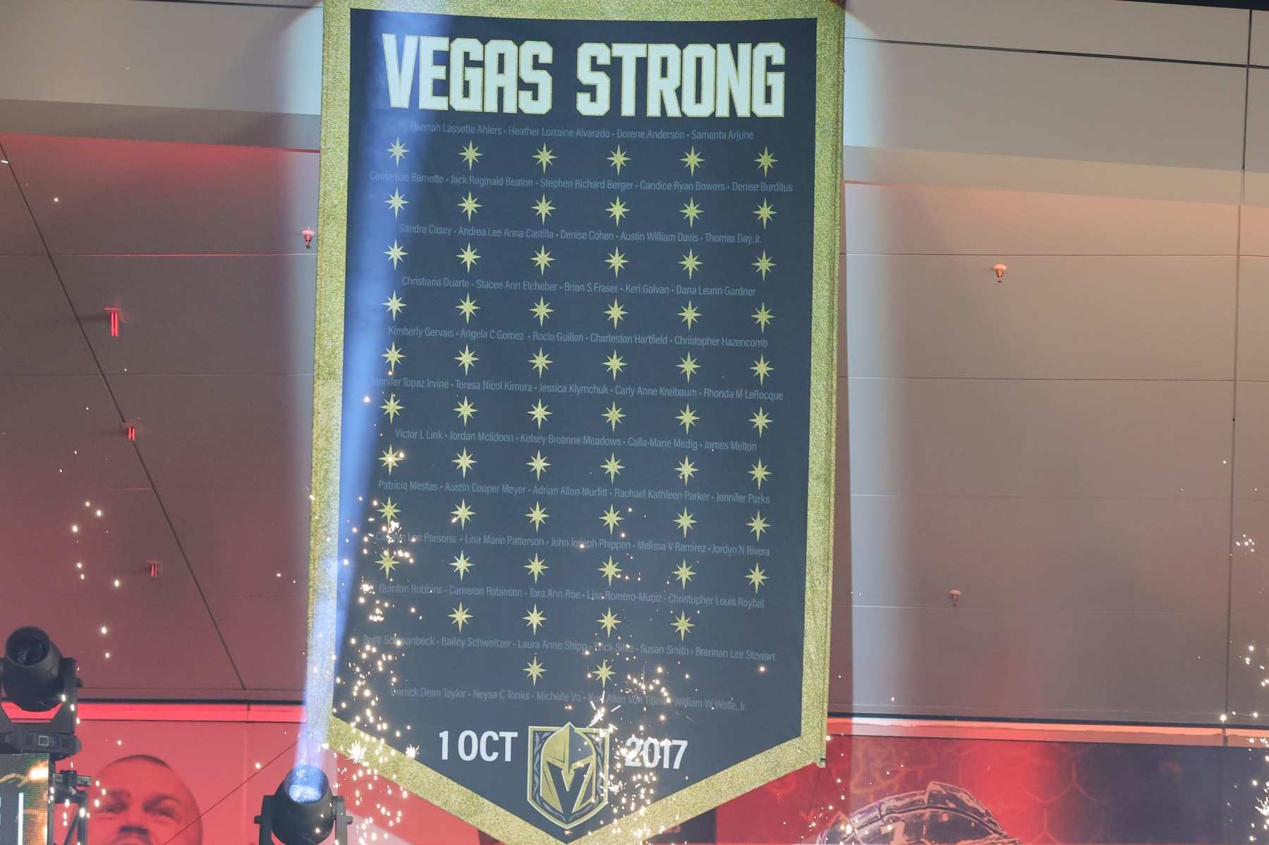LAS VEGAS, NEVADA - JUNE 17: Fans acknowledge a "Vegas Strong" banner honoring the 60 victims of the October 1, 2017, mass shooting on the Las Vegas Strip during a victory parade and rally for the Vegas Golden Knights outside T-Mobile Arena on June 17, 2023 in Las Vegas, Nevada. The Golden Knights defeated the Florida Panthers four games to one to win the 2023 NHL Stanley Cup Final. (Photo by Ethan Miller/Getty Images)