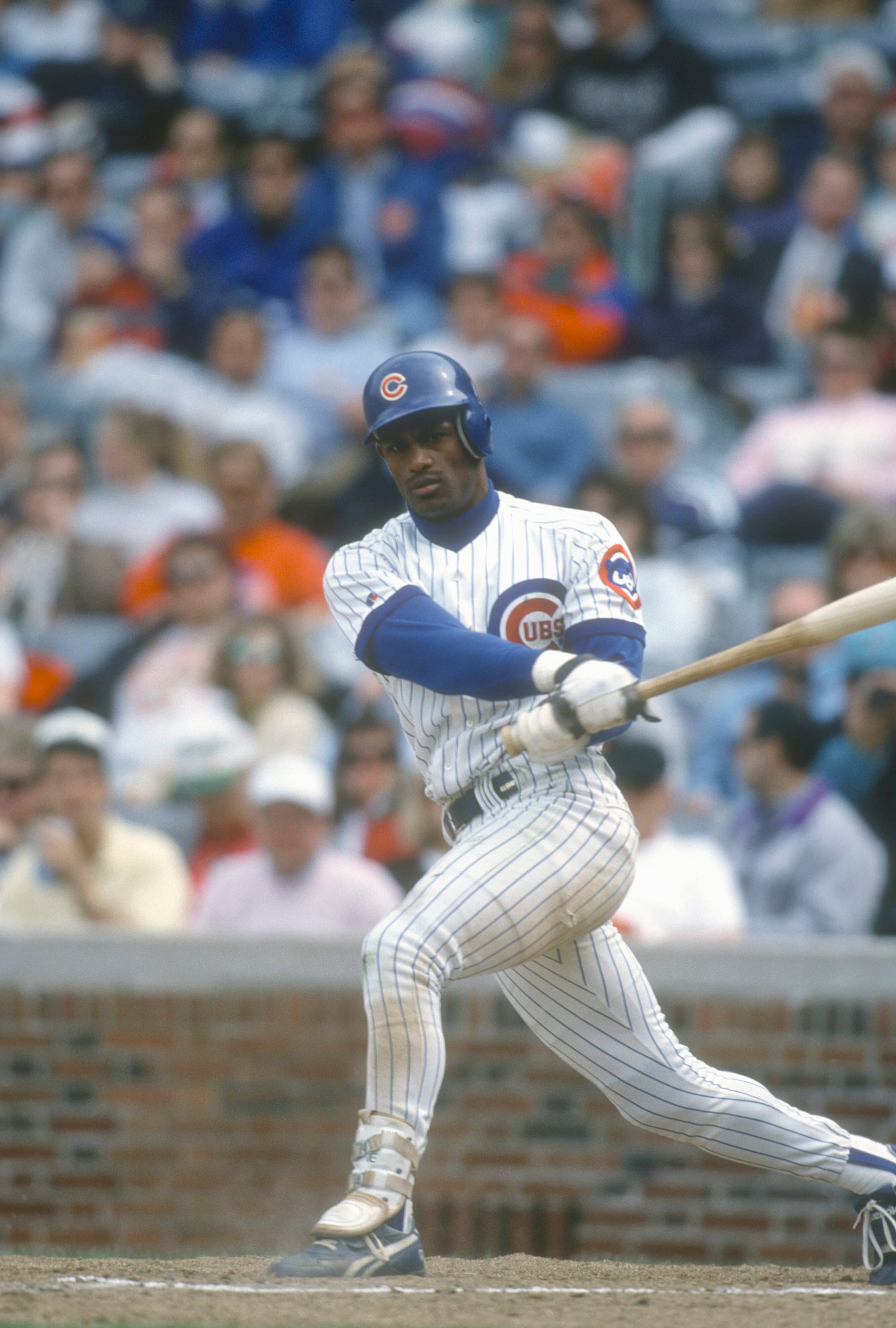 CHICAGO, IL - CIRCA 1993:  Sammy Sosa #21 of the Chicago Cubs bats during an Major League Baseball game circa 1993 at Wrigley Field in Chicago, Illinois. Sosa played for the Cubs 1992-2004. (Photo by Focus on Sport/Getty Images)