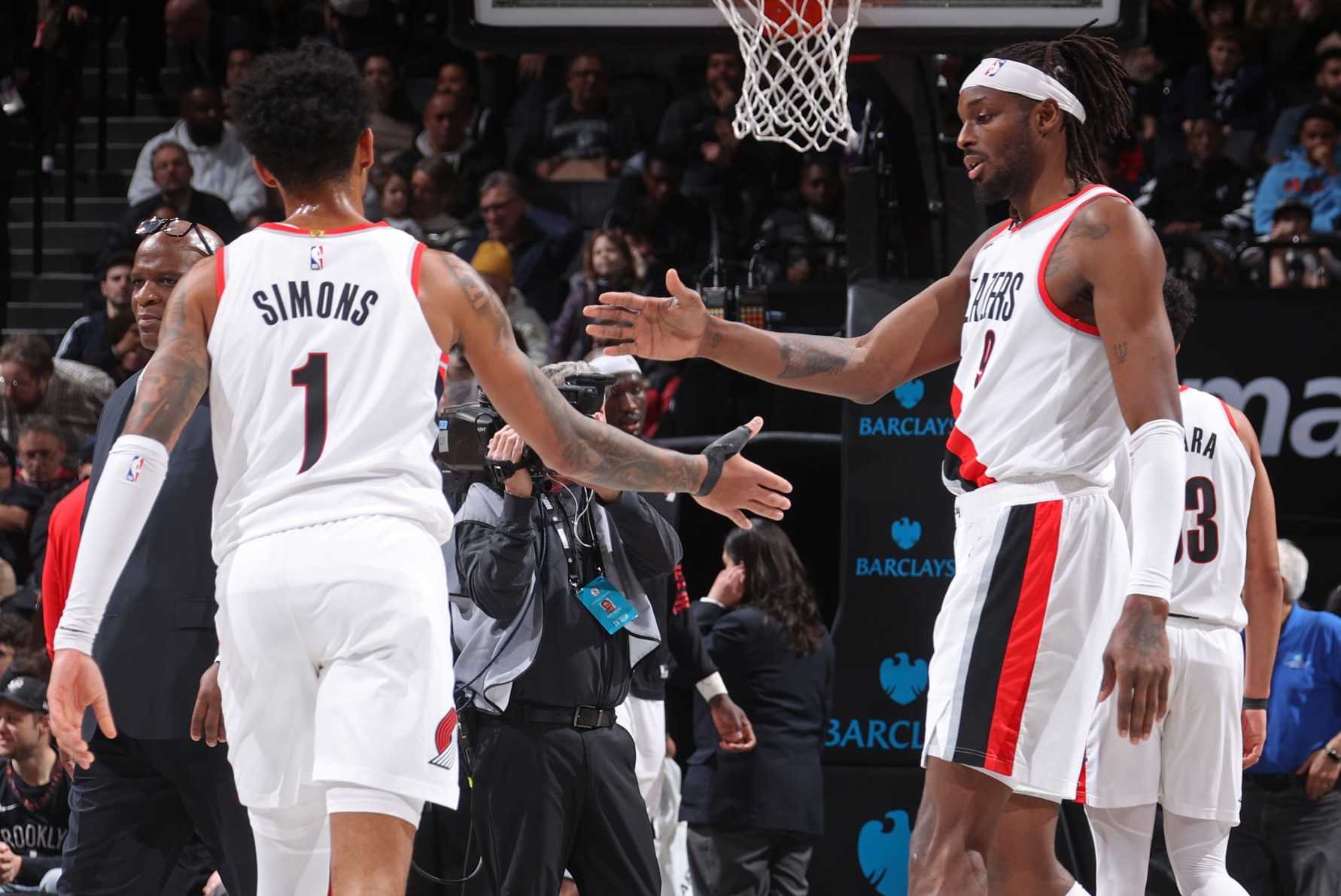 BROOKLYN, NY - JANUARY 7: Jerami Grant #9 and Anfernee Simons #1 of the Portland Trail Blazers high five during the game against the Brooklyn Nets on January 7, 2024 at Barclays Center in Brooklyn, New York. NOTE TO USER: User expressly acknowledges and agrees that, by downloading and or using this Photograph, user is consenting to the terms and conditions of the Getty Images License Agreement. Mandatory Copyright Notice: Copyright 2024 NBAE (Photo by Nathaniel S. Butler/NBAE via Getty Images)