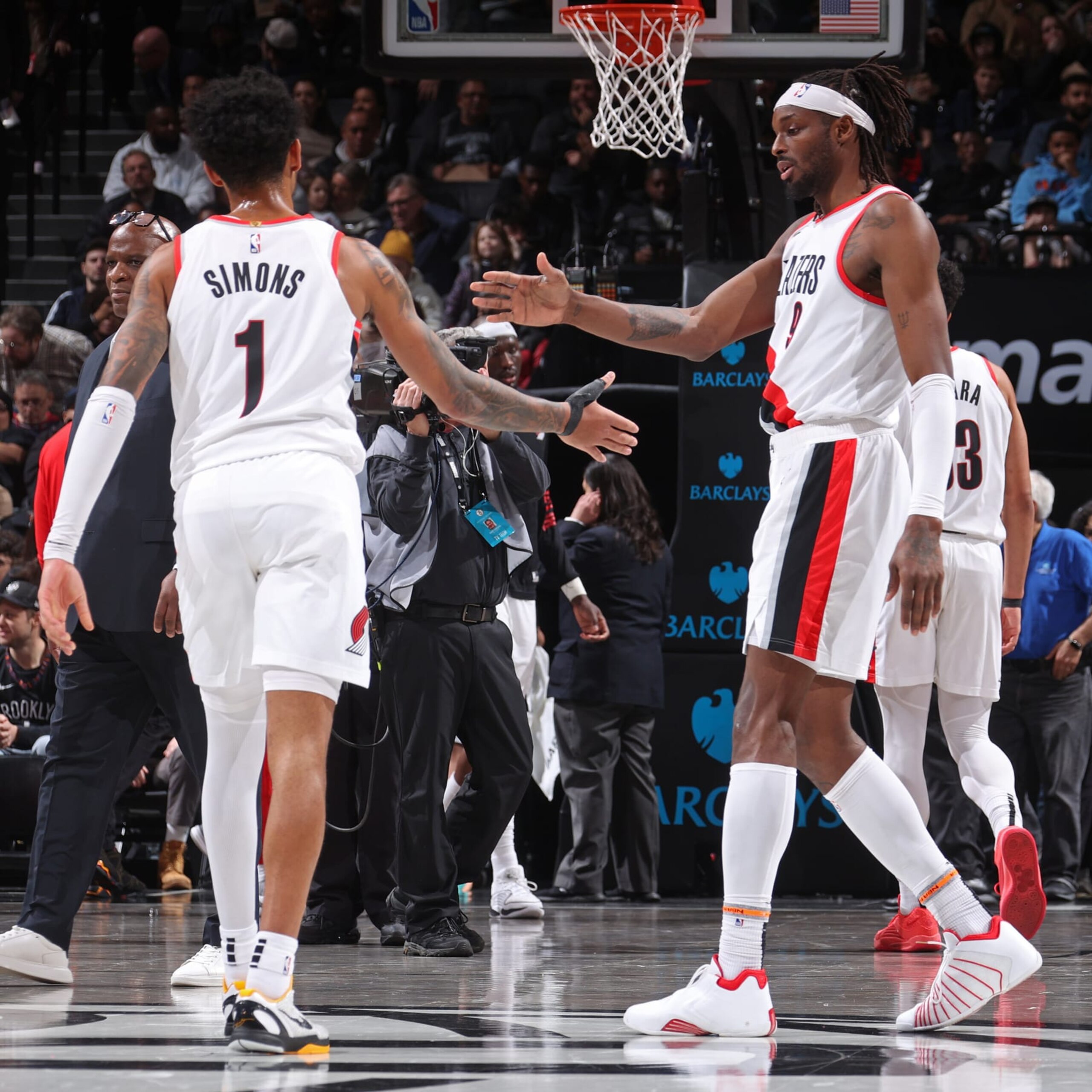 BROOKLYN, NY - JANUARY 7: Jerami Grant #9 and Anfernee Simons #1 of the Portland Trail Blazers high five during the game against the Brooklyn Nets on January 7, 2024 at Barclays Center in Brooklyn, New York. NOTE TO USER: User expressly acknowledges and agrees that, by downloading and or using this Photograph, user is consenting to the terms and conditions of the Getty Images License Agreement. Mandatory Copyright Notice: Copyright 2024 NBAE (Photo by Nathaniel S. Butler/NBAE via Getty Images) BROOKLYN, NY - JANUARY 7: Jerami Grant #9 and Anfernee Simons #1 of the Portland Trail Blazers high five during the game against the Brooklyn Nets on January 7, 2024 at Barclays Center in Brooklyn, New York. NOTE TO USER: User expressly acknowledges and agrees that, by downloading and or using this Photograph, user is consenting to the terms and conditions of the Getty Images License Agreement. Mandatory Copyright Notice: Copyright 2024 NBAE (Photo by Nathaniel S. Butler/NBAE via Getty Images)