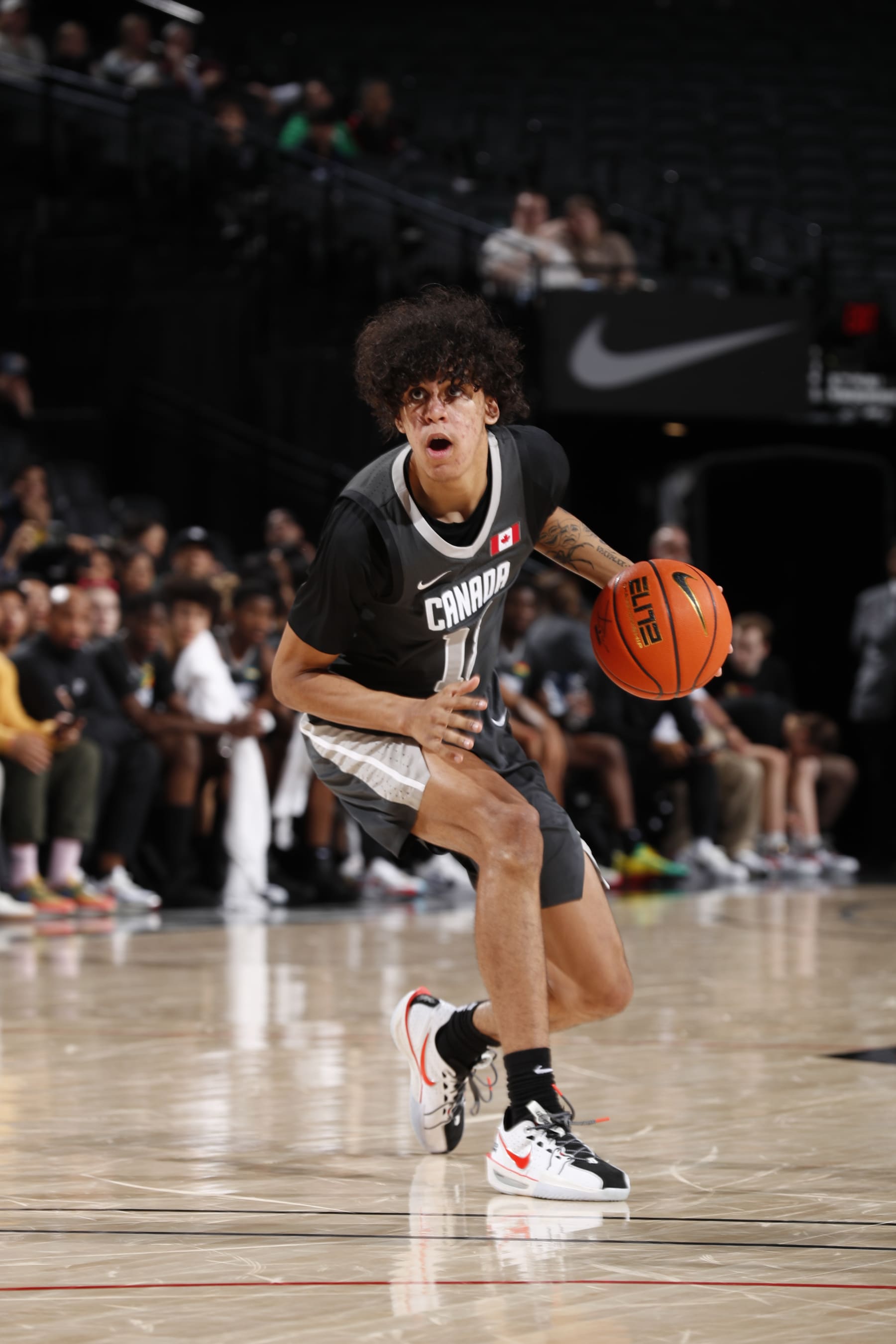 PORTLAND, OR - APRIL 13: Will Riley #13 of Team World dribbles the ball during the game against Team USA during the 2024 Nike Hoop Summit on April 13, 2024 at the Moda Center Arena in Portland, Oregon. NOTE TO USER: User expressly acknowledges and agrees that, by downloading and or using this photograph, user is consenting to the terms and conditions of the Getty Images License Agreement. Mandatory Copyright Notice: Copyright 2024 NBAE (Photo by Cameron Browne/NBAE via Getty Images)