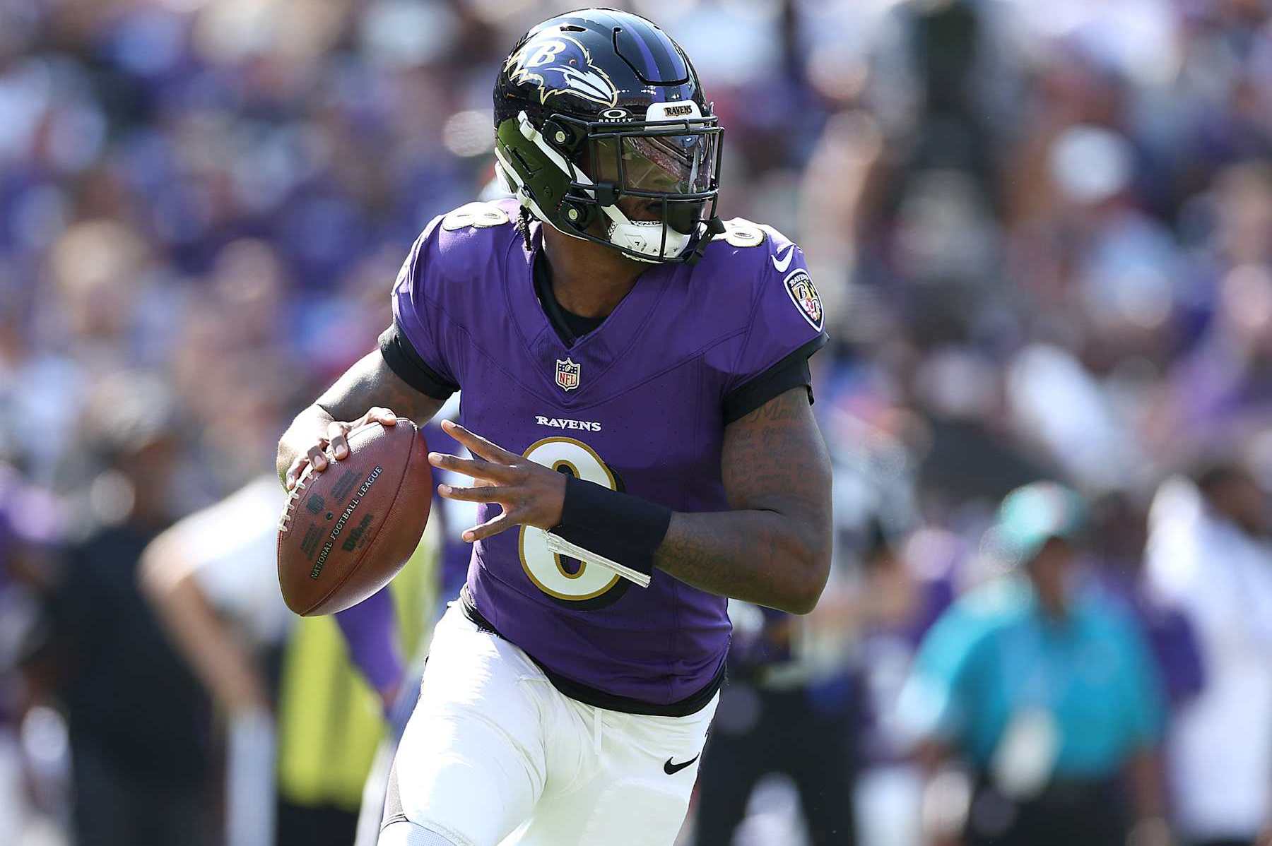 BALTIMORE, MARYLAND - OCTOBER 13: Lamar Jackson #8 of the Baltimore Ravens looks to pass against the Washington Commanders during the first quarter at M&T Bank Stadium on October 13, 2024 in Baltimore, Maryland. (Photo by Patrick Smith/Getty Images)