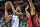 LAS VEGAS, NEVADA - JULY 11: Keyontae Johnson #18 of the Oklahoma City Thunder shoots over Jermaine Samuels Jr. #57 of the Houston Rockets at the Thomas & Mack Center on July 11, 2023 in Las Vegas, Nevada. NOTE TO USER: User expressly acknowledges and agrees that, by downloading and or using this photograph, User is consenting to the terms and conditions of the Getty Images License Agreement. (Photo by Allen Berezovsky/Getty Images)