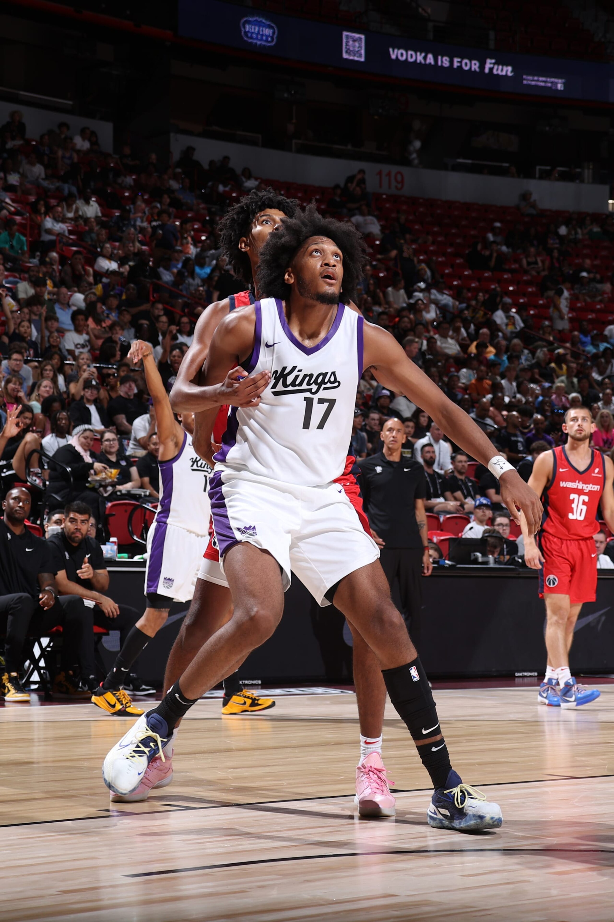 LAS VEGAS, NV - JULY 18: Isaac Jones #17 of the Sacramento Kings boxes out John Butler Jr. #19 of the Washington Wizards during the game on July 18, 2024 at the Thomas & Mack Center in Las Vegas, Nevada. NOTE TO USER: User expressly acknowledges and agrees that, by downloading and or using this photograph, User is consenting to the terms and conditions of the Getty Images License Agreement. Mandatory Copyright Notice: Copyright 2024 NBAE (Photo by Stephen Gosling/NBAE via Getty Images) LAS VEGAS, NV - JULY 18: Isaac Jones #17 of the Sacramento Kings boxes out John Butler Jr. #19 of the Washington Wizards during the game on July 18, 2024 at the Thomas & Mack Center in Las Vegas, Nevada. NOTE TO USER: User expressly acknowledges and agrees that, by downloading and or using this photograph, User is consenting to the terms and conditions of the Getty Images License Agreement. Mandatory Copyright Notice: Copyright 2024 NBAE (Photo by Stephen Gosling/NBAE via Getty Images)