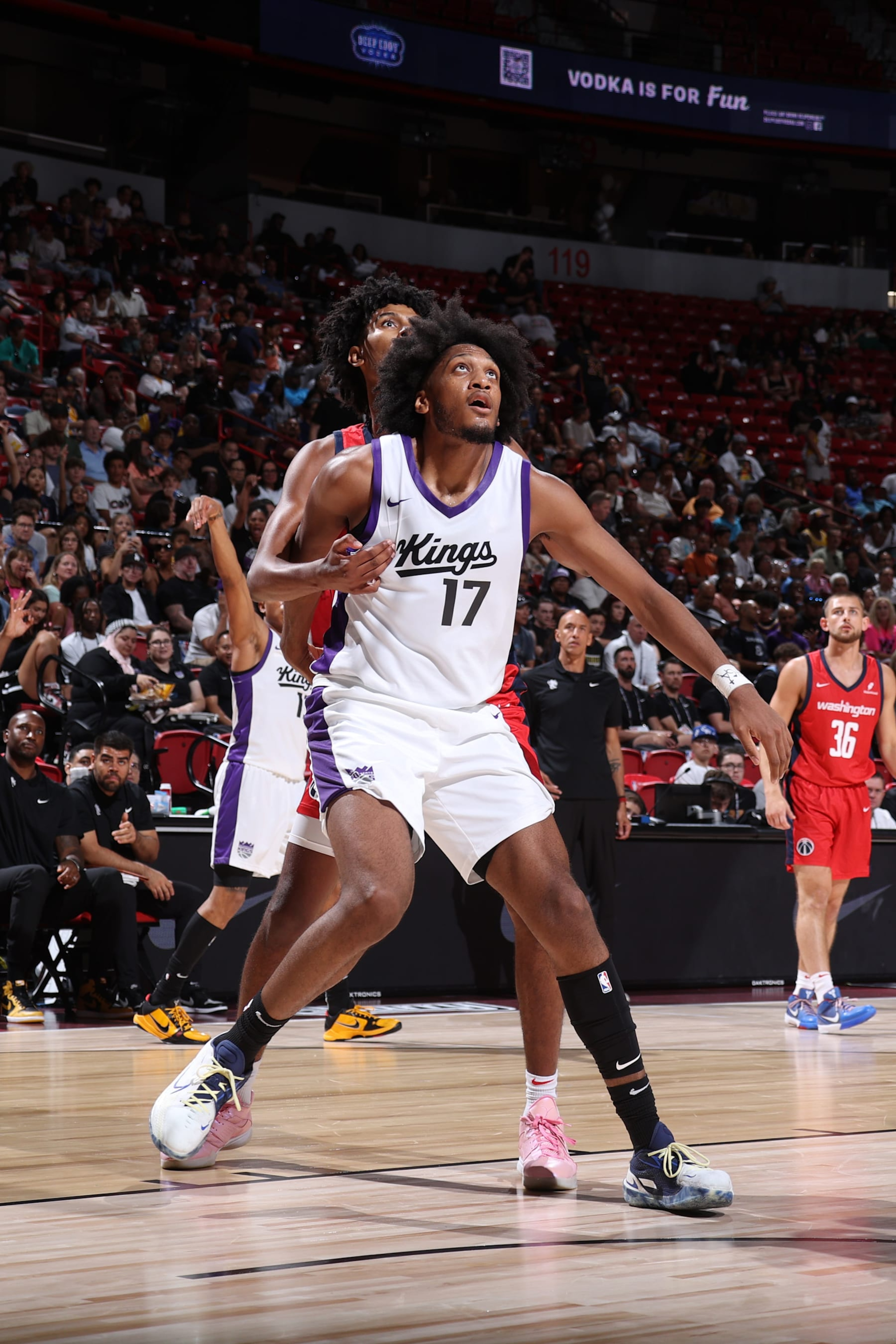 LAS VEGAS, NV - JULY 18:  Isaac Jones #17 of the Sacramento Kings boxes out John Butler Jr. #19 of the Washington Wizards during the game  on July 18, 2024 at the Thomas & Mack Center in Las Vegas, Nevada. NOTE TO USER: User expressly acknowledges and agrees that, by downloading and or using this photograph, User is consenting to the terms and conditions of the Getty Images License Agreement. Mandatory Copyright Notice: Copyright 2024 NBAE (Photo by Stephen Gosling/NBAE via Getty Images)