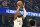 Cleveland Cavaliers guard Donovan Mitchell shoots a three-point basket during the first half of an NBA basketball game against the Philadelphia 76ers, Wednesday, Nov. 30, 2022, in Cleveland. (AP Photo/Nick Cammett)