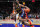 HOUSTON, TEXAS - MARCH 28: Isaiah Collier #4 of the West team dribbles the ball during the 2023 McDonald's High School Boys All-American Game at Toyota Center on March 28, 2023 in Houston, Texas. (Photo by Alex Bierens de Haan/Getty Images)