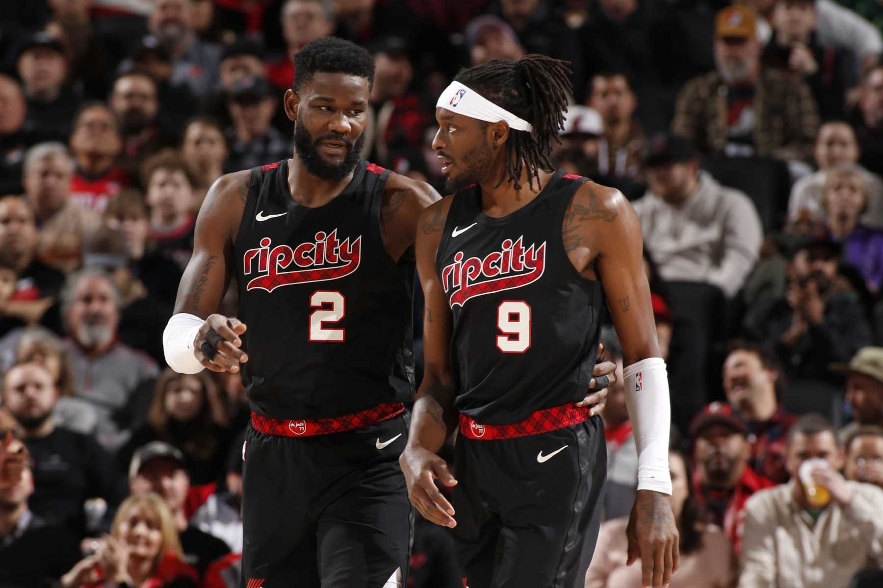 PORTLAND, OR - FEBRUARY 27: Deandre Ayton #2 of the Portland Trail Blazers talks with Jerami Grant #9 during the game against the Miami Heat on February 27, 2024 at the Moda Center Arena in Portland, Oregon. NOTE TO USER: User expressly acknowledges and agrees that, by downloading and or using this photograph, user is consenting to the terms and conditions of the Getty Images License Agreement. Mandatory Copyright Notice: Copyright 2024 NBAE (Photo by Cameron Browne/NBAE via Getty Images)