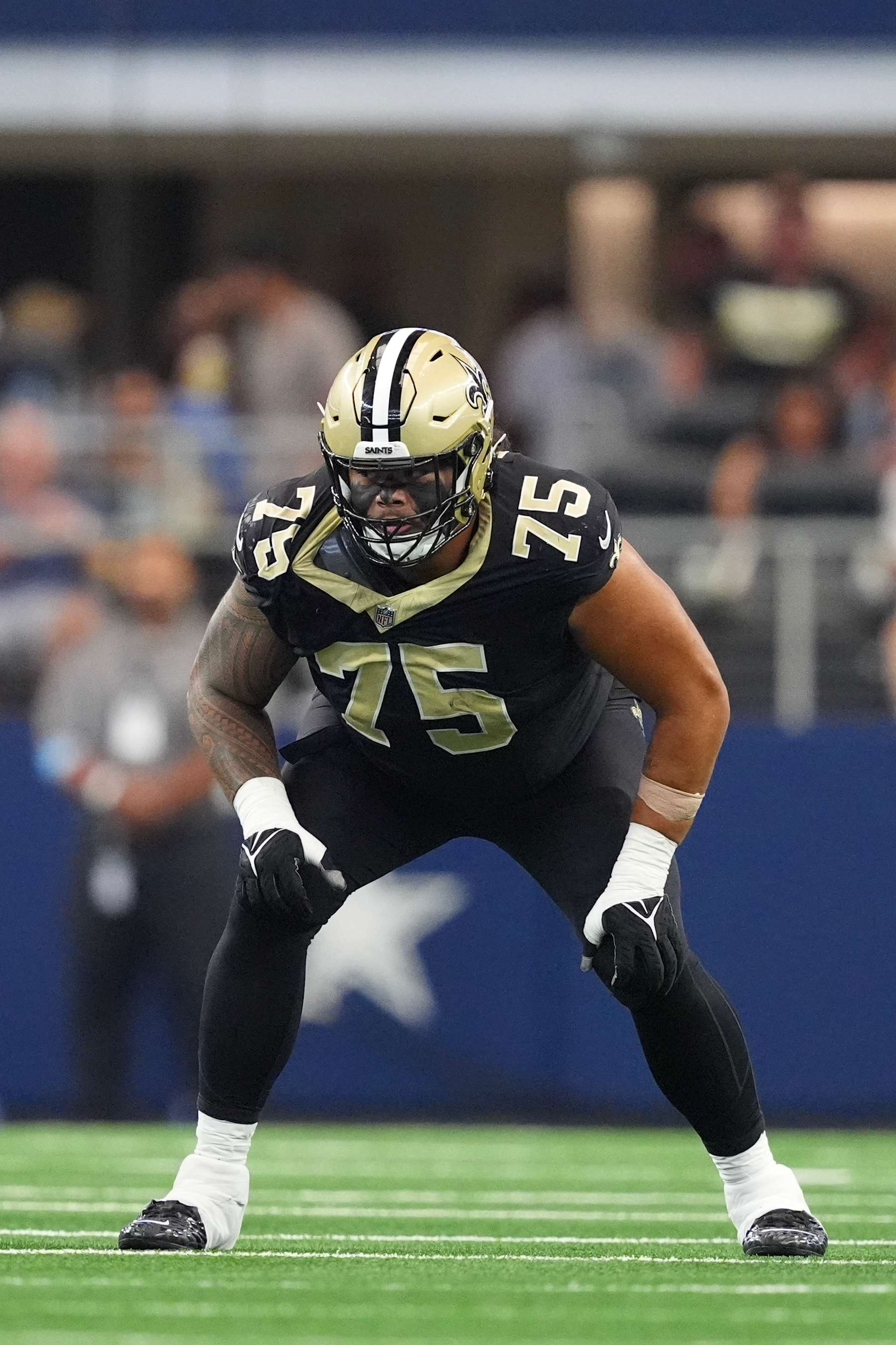 ARLINGTON, TEXAS - SEPTEMBER 15: Taliese Fuaga #75 of the New Orleans Saints in action during the second half against the Dallas Cowboys at AT&T Stadium on September 15, 2024 in Arlington, Texas. (Photo by Sam Hodde/Getty Images)