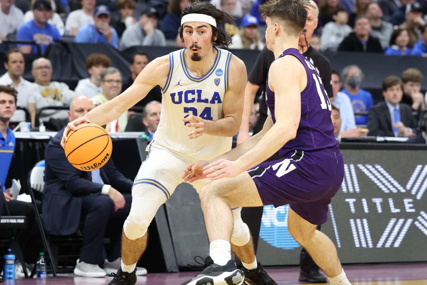 SACRAMENTO, CALIFORNIA - MARCH 18: Jaime Jaquez Jr. #24 of the UCLA Bruins drives to the basket during the second half against the Brooks Barnhizer #13 of the Northwestern Wildcats in the second round of the NCAA Men's Basketball Tournament at Golden 1 Center on March 18, 2023 in Sacramento, California. (Photo by Ezra Shaw/Getty Images)