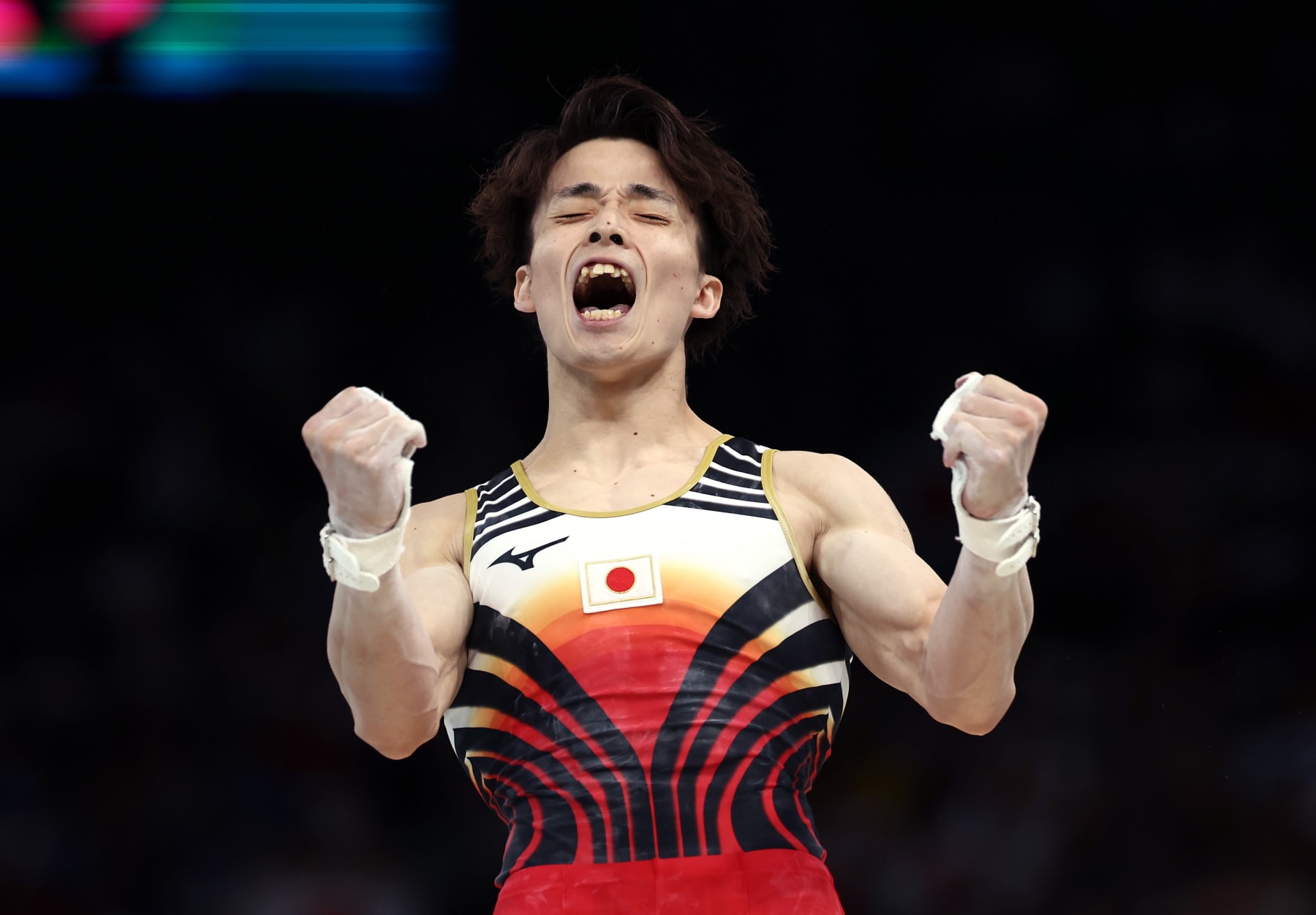 PARIS, FRANCE - JULY 29: Takaaki Sugino of Team Japan celebrates after his routine on the high bar during the Artistic Gymnastics Men's Team Final on day three of the Olympic Games Paris 2024 at Bercy Arena on July 29, 2024 in Paris, France. (Photo by Naomi Baker/Getty Images)