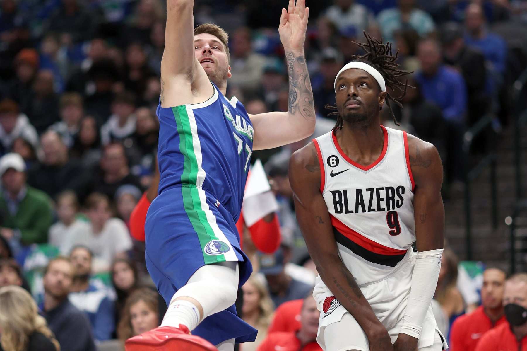 DALLAS, TEXAS - NOVEMBER 12: Luka Doncic #77 of the Dallas Mavericks shoots the ball against Jerami Grant #9 of the Portland Trail Blazers in the fourth quarter at American Airlines Center on November 12, 2022 in Dallas, Texas. NOTE TO USER: User expressly acknowledges and agrees that, by downloading and or using this photograph, User is consenting to the terms and conditions of the Getty Images License Agreement. (Photo by Tom Pennington/Getty Images)