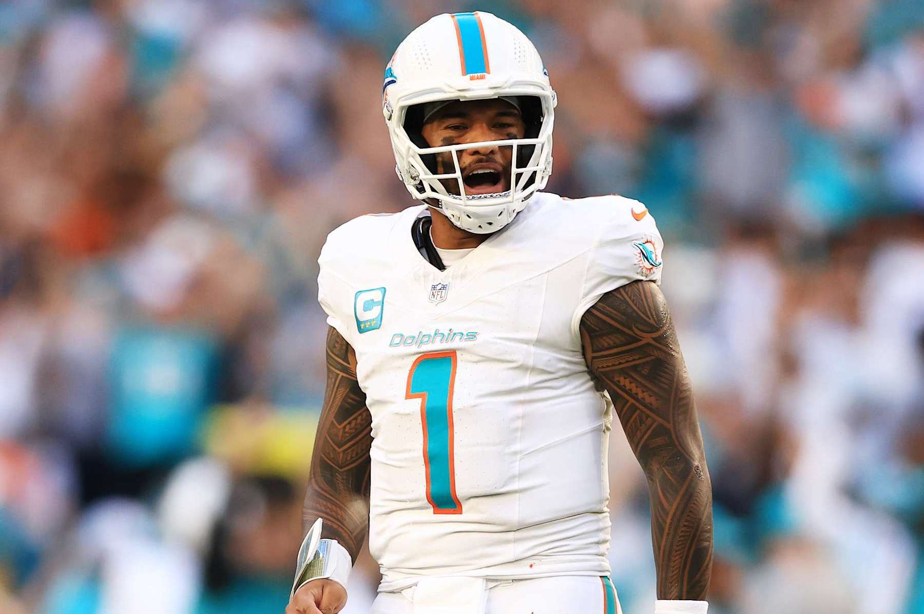 MIAMI GARDENS, FLORIDA - DECEMBER 08: Tua Tagovailoa #1 of the Miami Dolphins reacts after a play in the second half of a game against the New York Jets at Hard Rock Stadium on December 08, 2024 in Miami Gardens, Florida. (Photo by Megan Briggs/Getty Images)