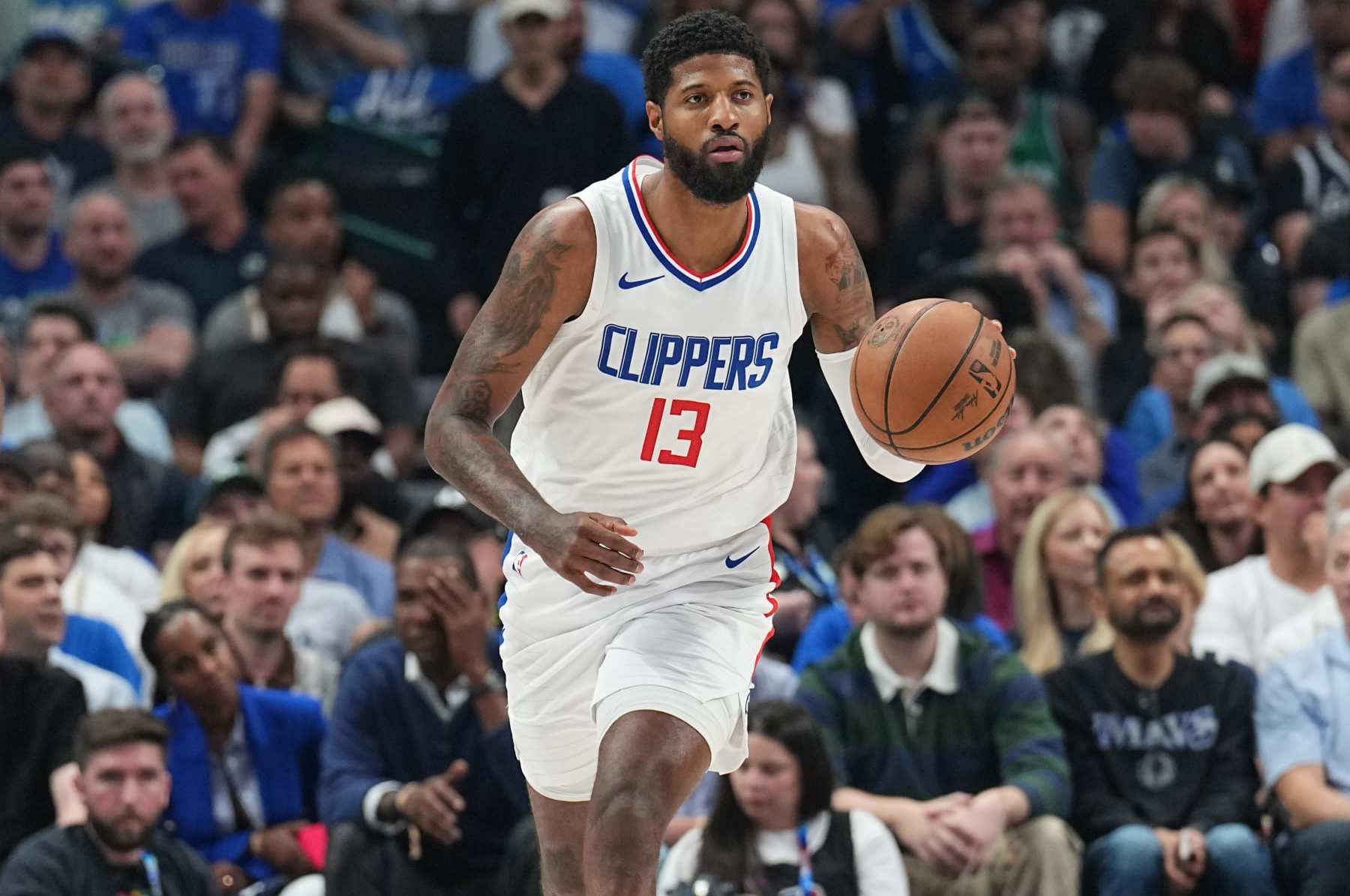 DALLAS, TX - MAY 3: Paul George #13 of the LA Clippers handles the ball during the game against the Dallas Mavericks during Round 1 Game 6 of the 2024 NBA Playoffs on May 3, 2024 at the American Airlines Center in Dallas, Texas. NOTE TO USER: User expressly acknowledges and agrees that, by downloading and or using this photograph, User is consenting to the terms and conditions of the Getty Images License Agreement. Mandatory Copyright Notice: Copyright 2024 NBAE (Photo by Glenn James/NBAE via Getty Images)