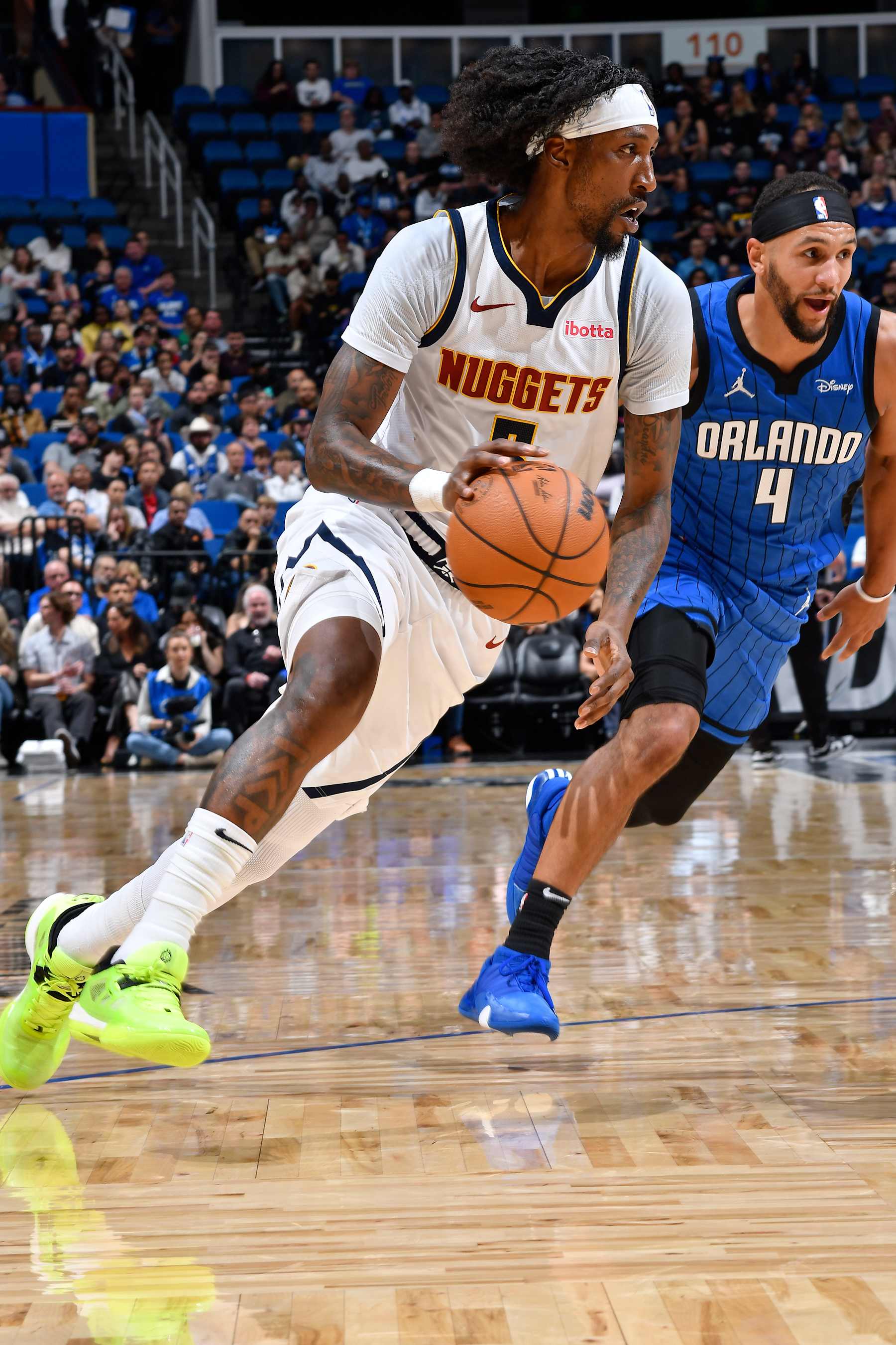ORLANDO, FL - NOVEMBER 22: Kentavious Caldwell-Pope #5 of the Denver Nuggets dribbles the ball during the game against the Orlando Magic on November 22, 2023 at Amway Center in Orlando, Florida. NOTE TO USER: User expressly acknowledges and agrees that, by downloading and or using this photograph, User is consenting to the terms and conditions of the Getty Images License Agreement. Mandatory Copyright Notice: Copyright 2023 NBAE (Photo by Gary Bassing/NBAE via Getty Images)