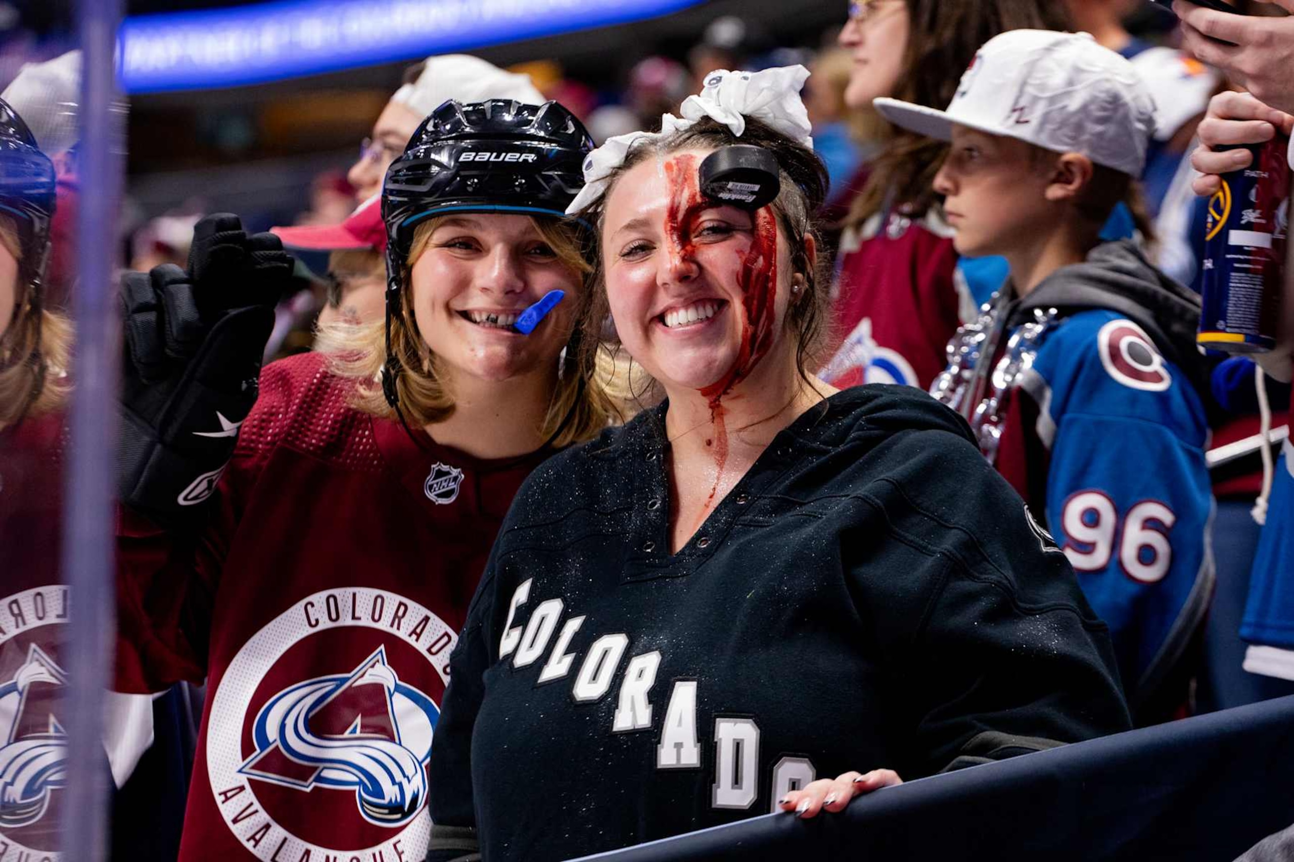 DENVER, COLORADO - OCTOBER 30: Two Colorado Avalanche fans pose for a photo in hockey-themed Halloween costumes during warm-up ahead of the game against the Tampa Bay Lightning at Ball Arena on October 30, 2024 in Denver, Colorado. (Photo by Ashley Potts/NHLI via Getty Images)