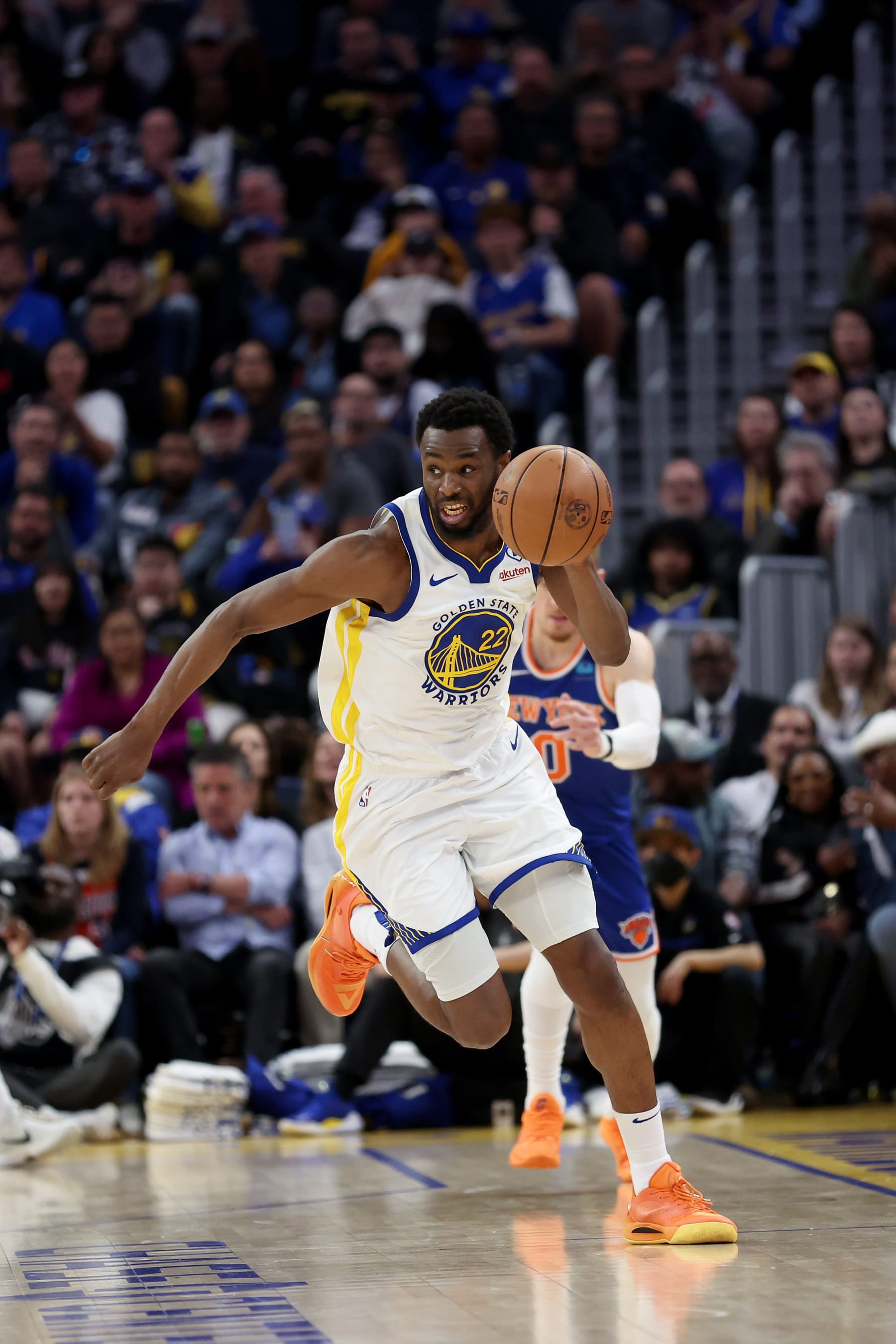 SAN FRANCISCO, CALIFORNIA - MARCH 18: Andrew Wiggins #22 of the Golden State Warriors dribbles the ball against the New York Knicks at Chase Center on March 18, 2024 in San Francisco, California. NOTE TO USER: User expressly acknowledges and agrees that, by downloading and or using this photograph, User is consenting to the terms and conditions of the Getty Images License Agreement.  (Photo by Ezra Shaw/Getty Images)