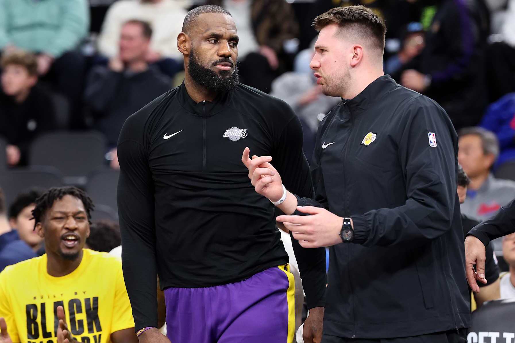 Inglewood, California February 4, 2025-Lakers LeBron James, left, and Luka Doncic talk during a timeout at the Intuit Dome Tuesday. (Wally Skalij/Los Angeles Times via Getty Images)