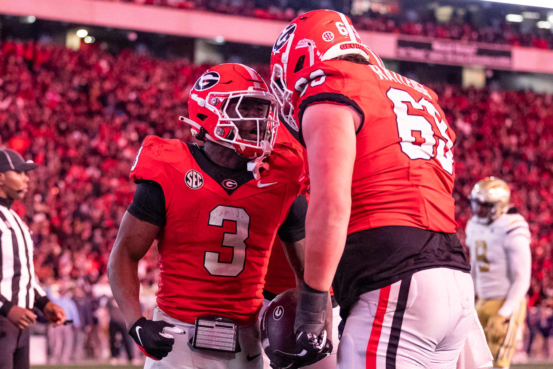 ATHENS, GEORGIA - NOVEMBER 29: Nate Frazier #3 and Tate Ratledge #69 of the Georgia Bulldogs celebrate a touchdown during a game between the Georgia Tech Yellow Jackets and the Georgia Bulldogs at Sanford Stadium on November 29, 2024 in Athens, Georgia. (Photo by Steve Limentani/ISI Photos/Getty Images)