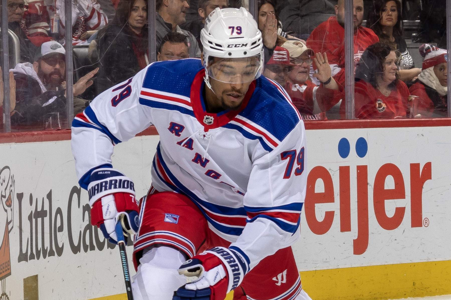 DETROIT, MI - FEBRUARY 23: K'Andre Miller #79 of the New York Rangers controls the puck behind the net against the Detroit Red Wings during the third period of an NHL game at Little Caesars Arena on February 23, 2023 in Detroit, Michigan. Detroit defeated New York 4-1.(Photo by Dave Reginek/NHLI via Getty Images)