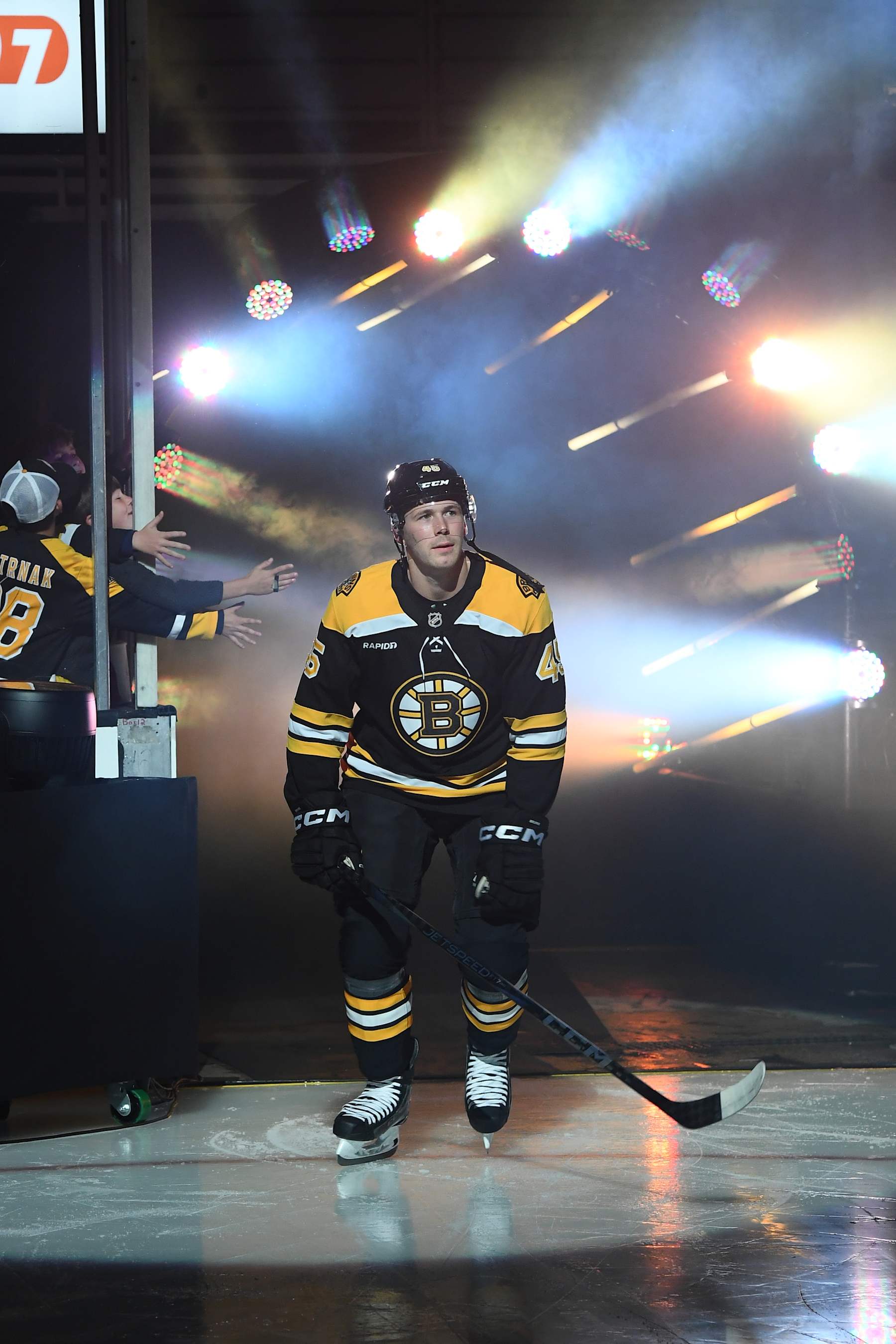 BOSTON, MASSACHUSETTS - OCTOBER 10: Cole Koepke #45 of the Boston Bruins skates out during the opening ceremony before the game against the Montreal Canadiens on October 10, 2024, at the TD Garden in Boston, Massachusetts. (Photo by Steve Babineau/NHLI via Getty Images)